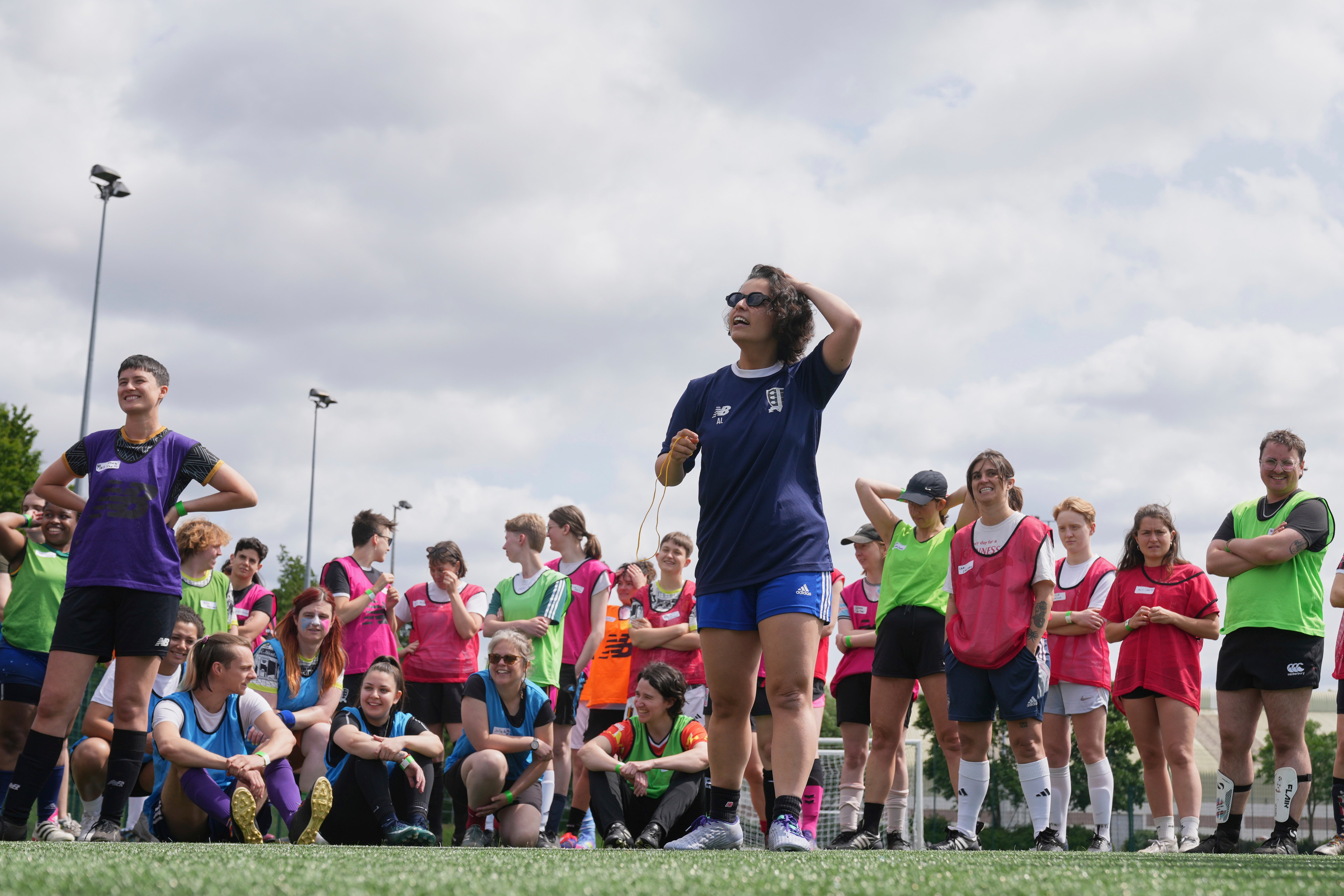 Amy Lester gives out instructions just ahead of the start of an inclusive six a side soccer friendly tournament in London, Sunday, June 1, 2025. (AP Photo/Alastair Grant)