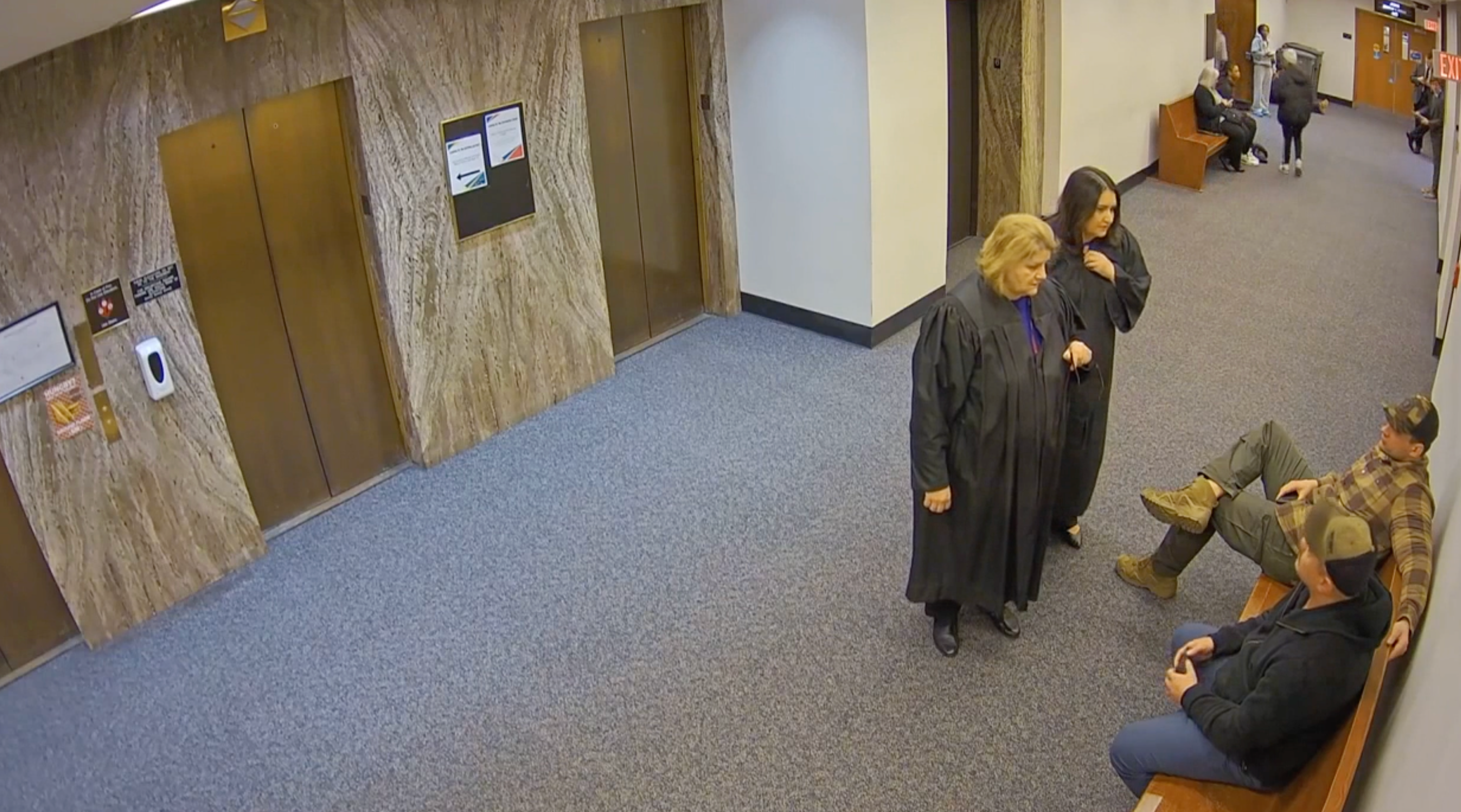 Judge Dugan can be seen speaking with federal agents inside the courthouse to make an immigration arrest on April 18. A criminal complaint accuses the judge of āconfrontational, angry demeanorā