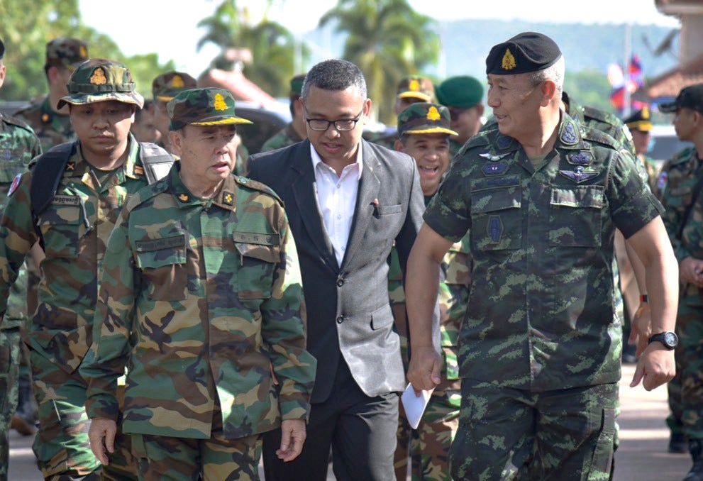 Cambodian army chief Mao Sophan, left, meets his Thai counterpart Pana Claewplodtook at a border checkpoint in Surin province