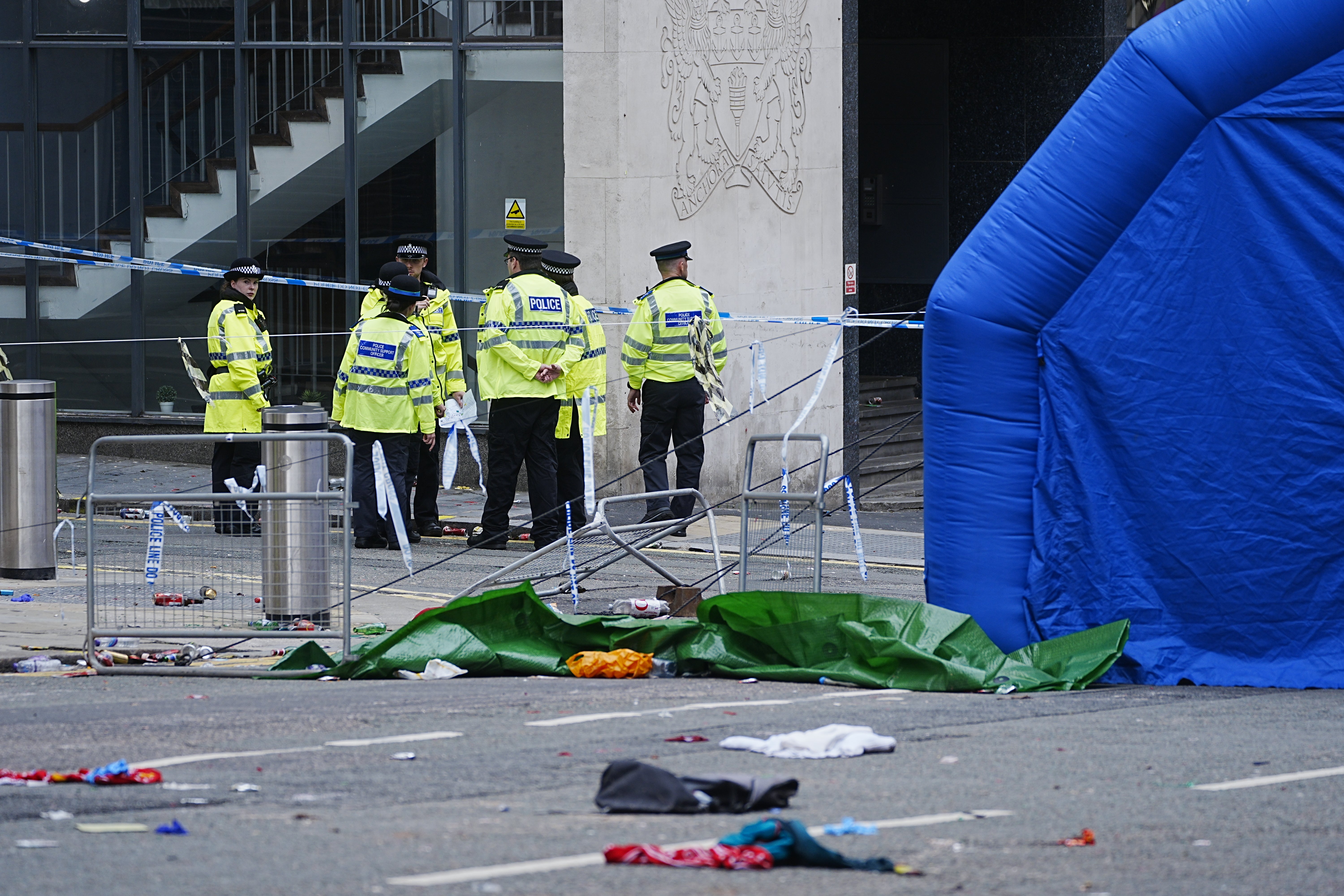 Police officers at the scene in Water Street near the Liver Building