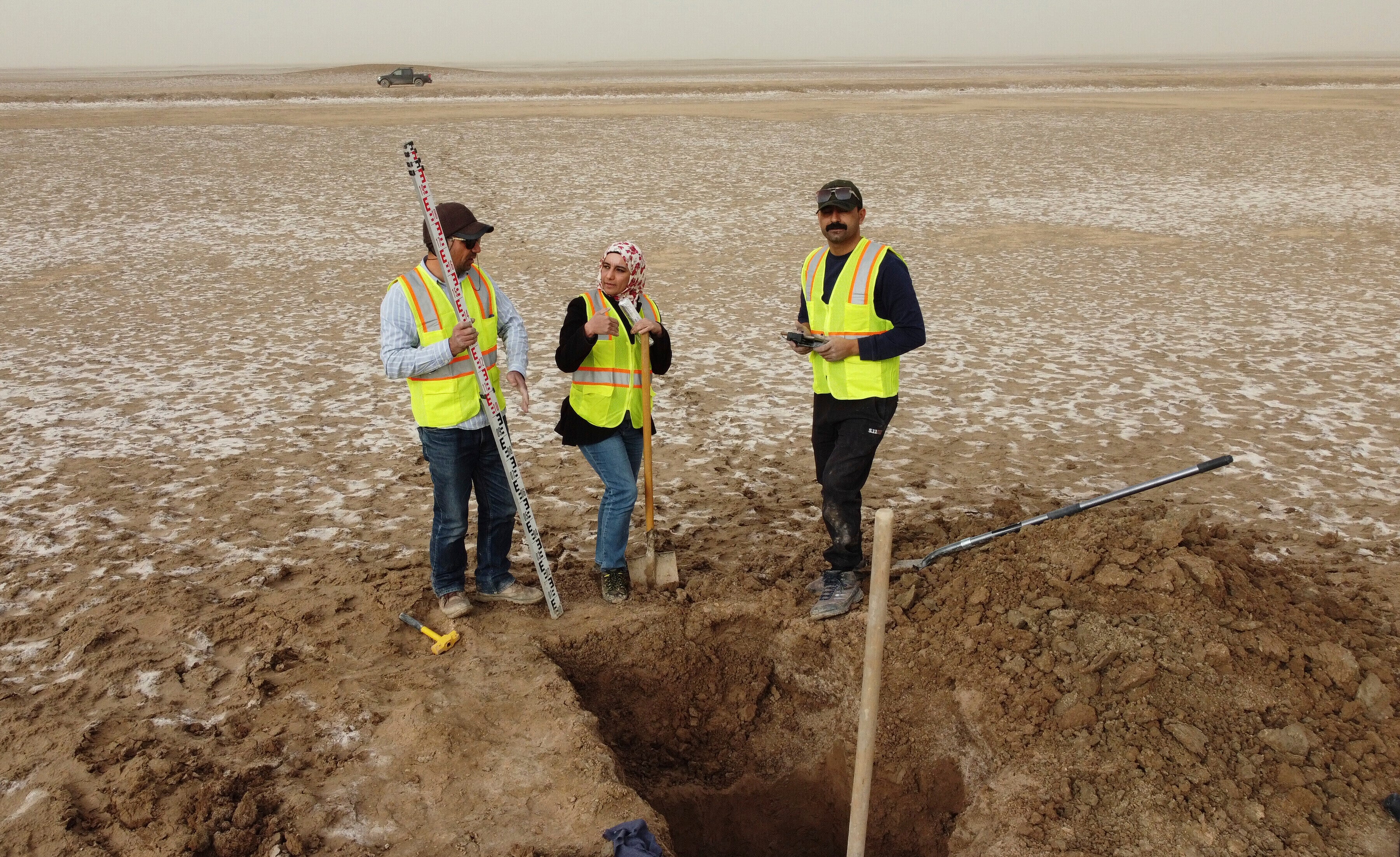 Archaeologists work at an archaeological site where researchers uncovered massive earthen structures, believed to have been built with slave labor, and found that their construction spanned several centuries, near Basra, Iraq, Friday, Jan. 28, 2022. (AP Photo/Jaafar Jotheri)