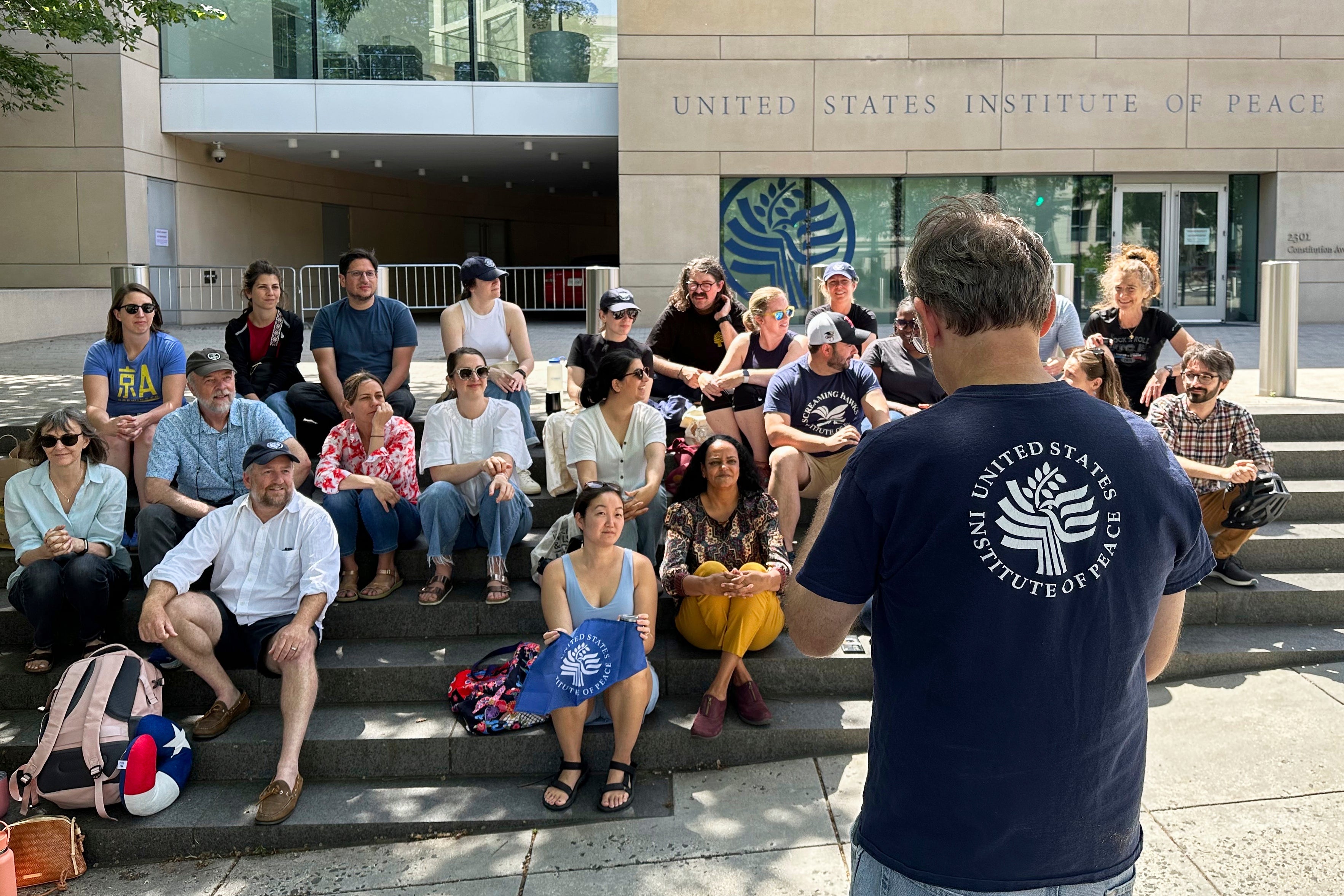 U.S. Institute of Peace employees held an impromptu celebration on May 19, following a ruling by U.S. District Judge Beryl Howell that DOGE's seizure of the independent entity had been unlawful.