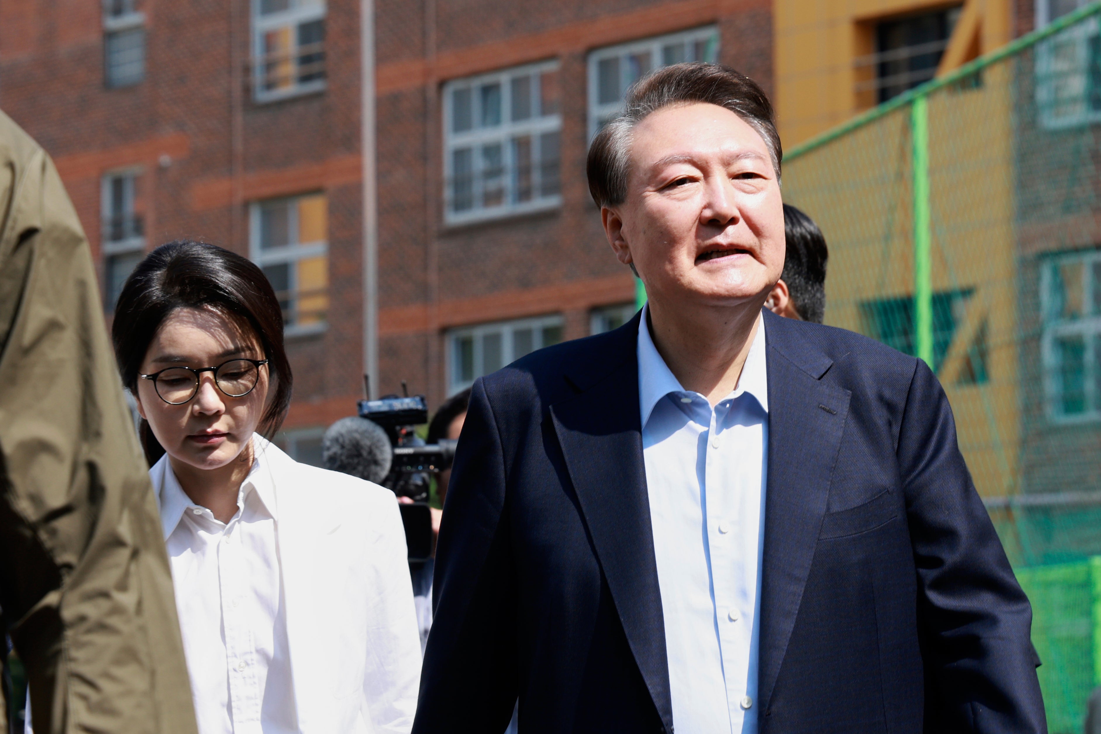 Former South Korean President Yoon Suk Yeol, right, and former first lady Kim Keon-Hee arrive to cast their votes for the presidential election at a polling station in Seoul, South Korea, 3 June 2025
