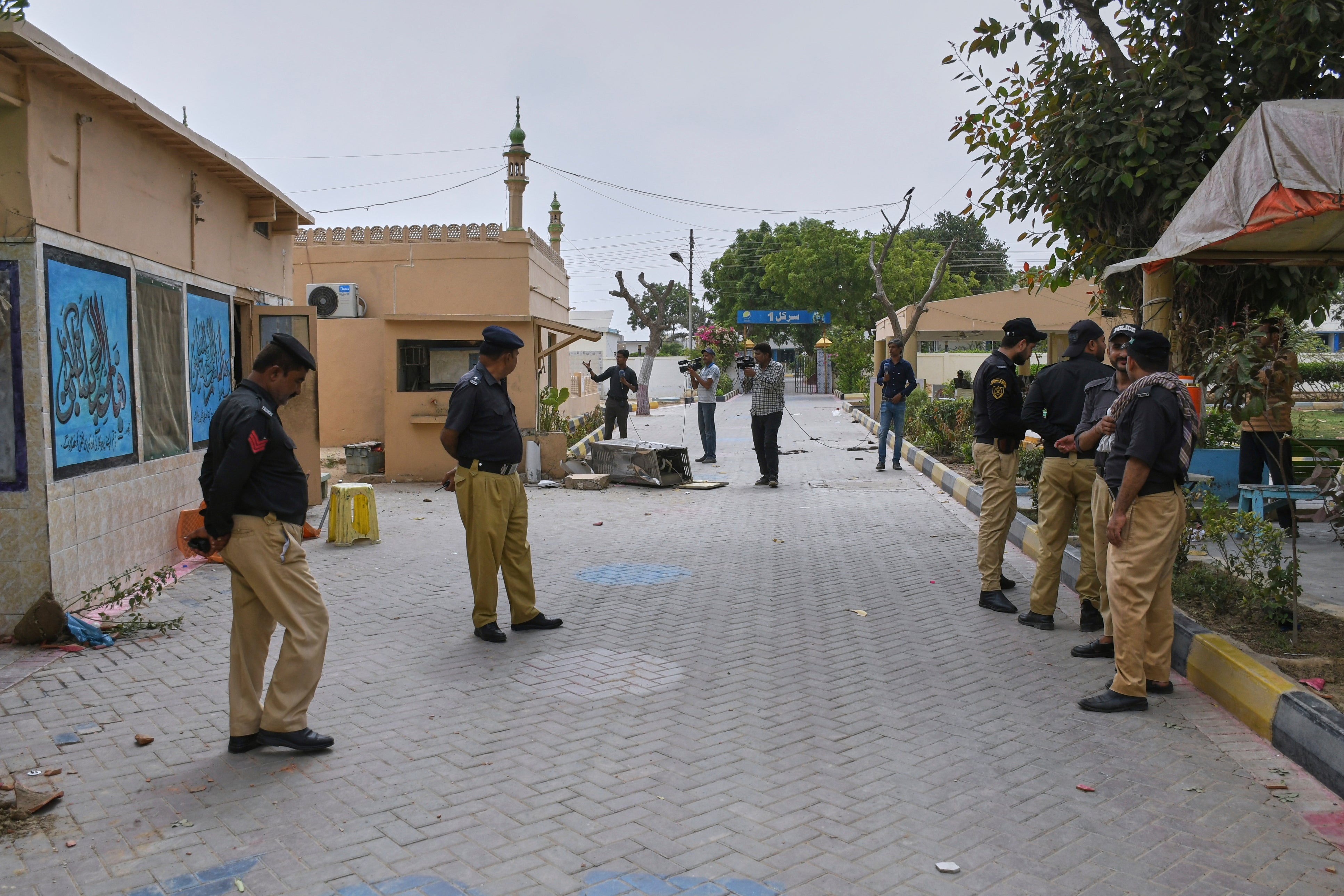 Police officers stand guard outside the prison