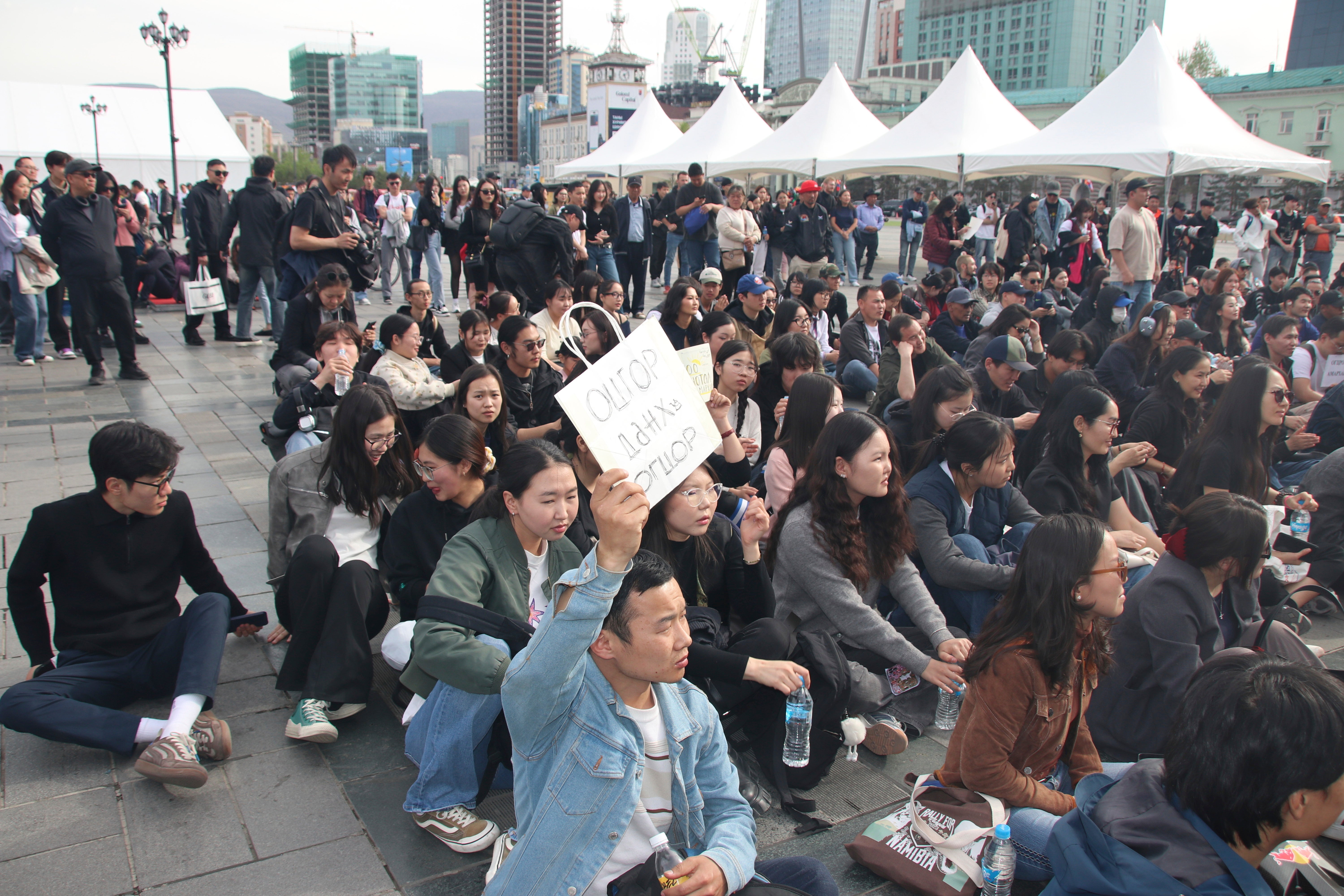 File A protestor holds a sign that reads ''Resign, Kettle, Resign'' in reference to Mongolia’s Prime Minister, at the Sukhbaatar Square in Ulaanbaatar, Mongolia, Thursday, May 22, 2025