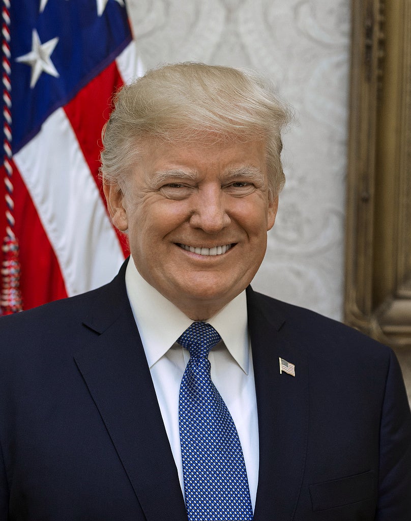 Trump's first term portrait showed a brightly lit president smiling at the camera