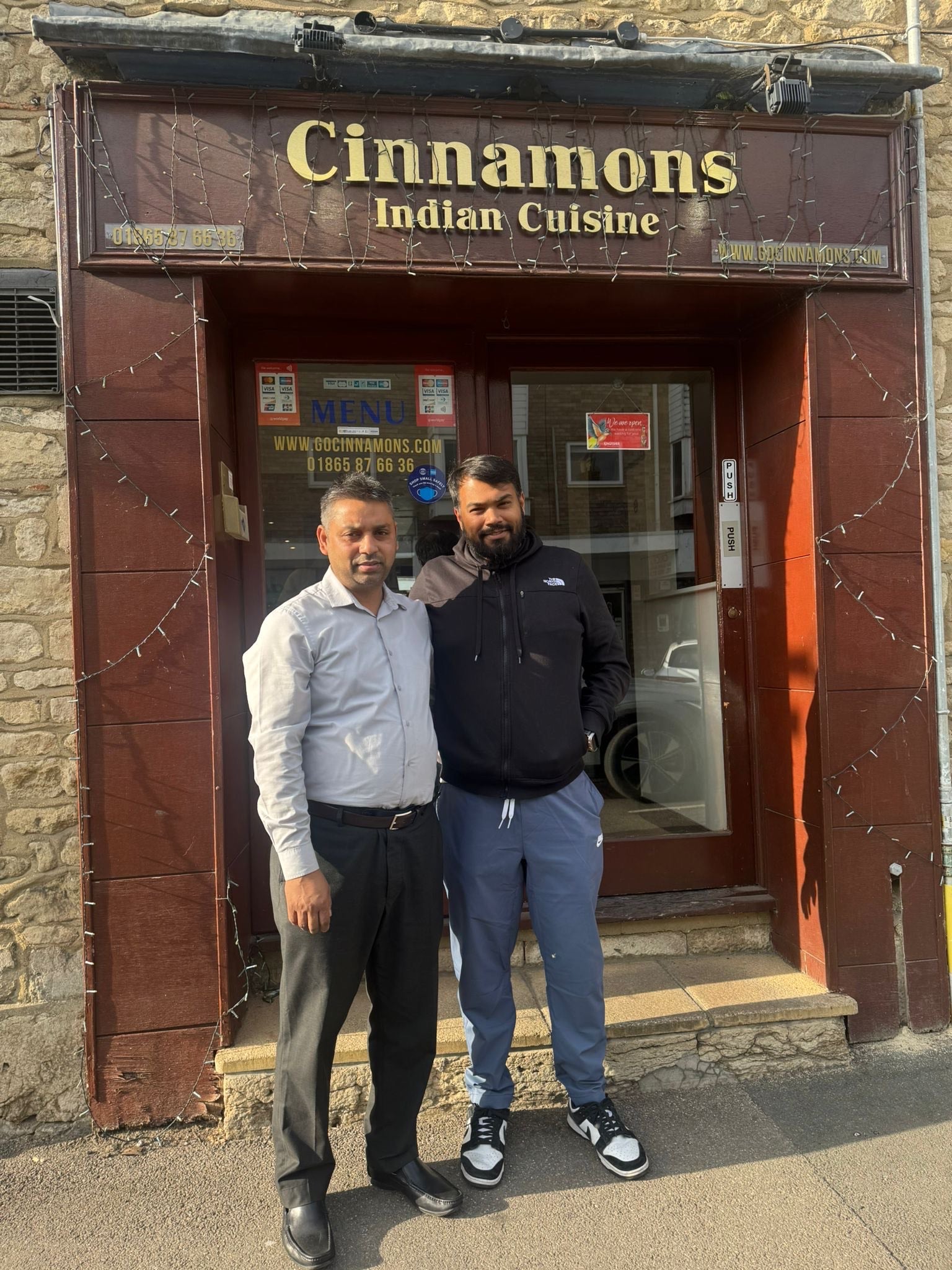Shirazul (right) with his uncle Muhammed. A popular curry house has been forced to close after two decades in business following complaints about it smelling of curry
