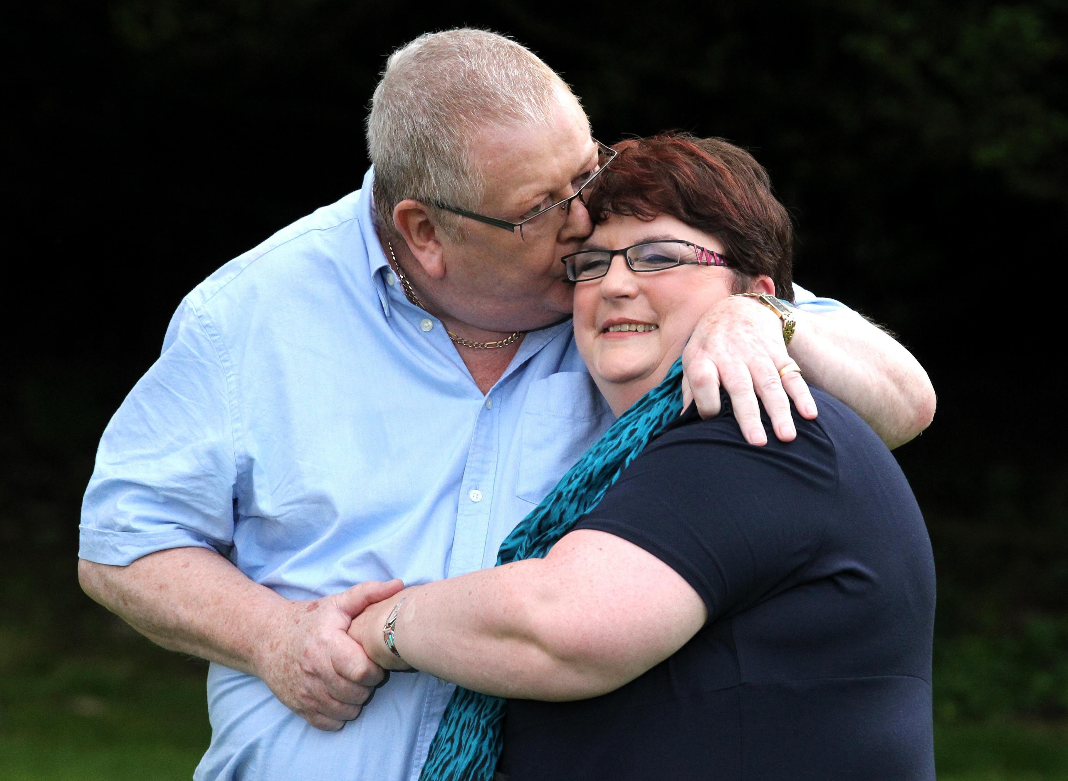 Colin and Chris Weir, from Largs in Ayrshire, kiss during a photocall after their life-changing £161m prize win