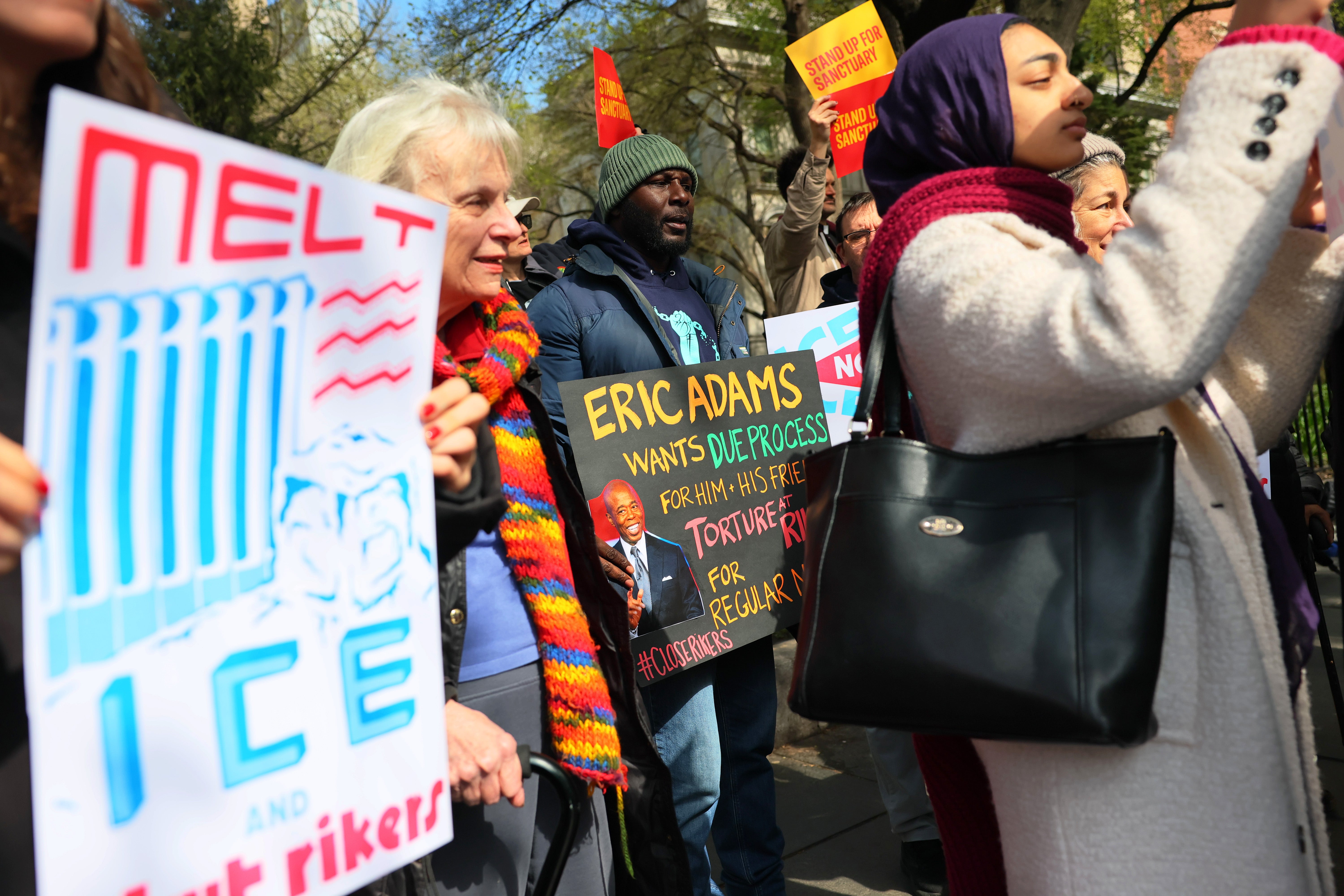 Protesters in New York rally against plans from Mayor Eric Adams to open the notorious city-run jails on Rikers Island to ICE agents. A state judge is putting those plans on hold, for now