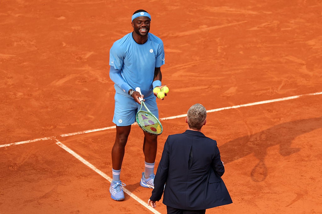 Tiafoe appeals a line call to chair umpire Timo Janzen