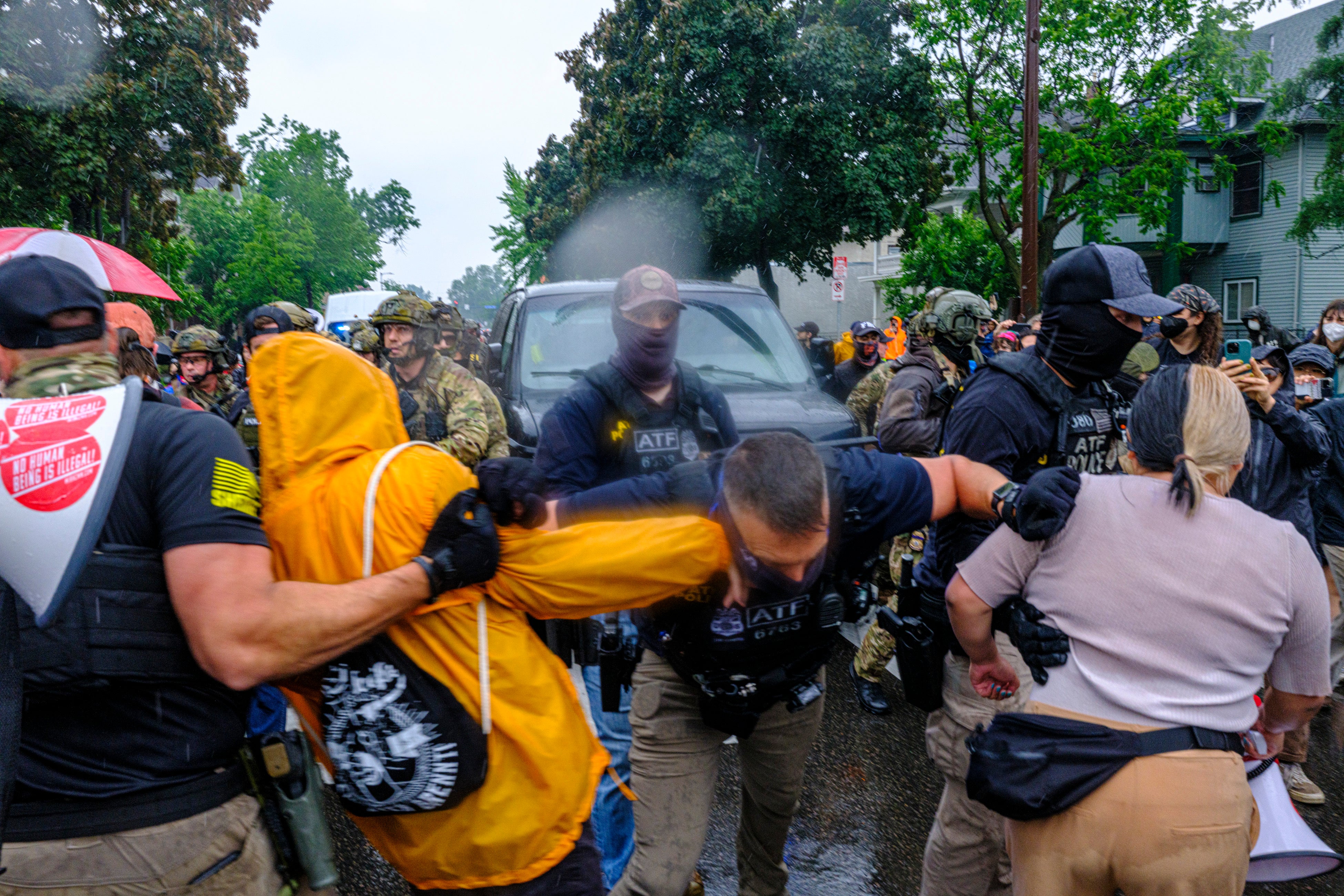 Critics say federal agents wearing masks during immigration enforcement limits oversight and leads to intimidation