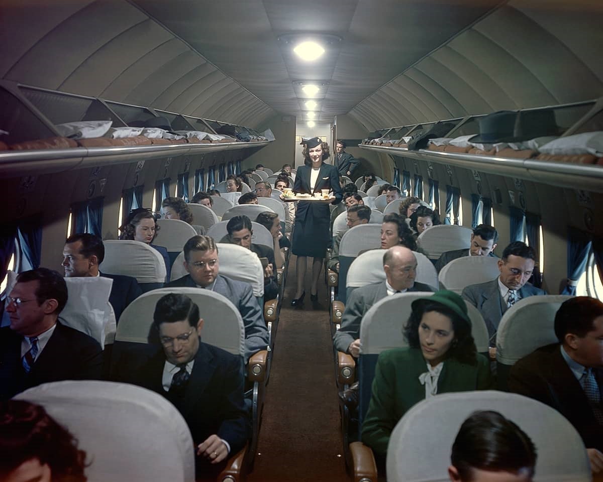Above is a Delta flight attendant in a 1940s winter navy jacket