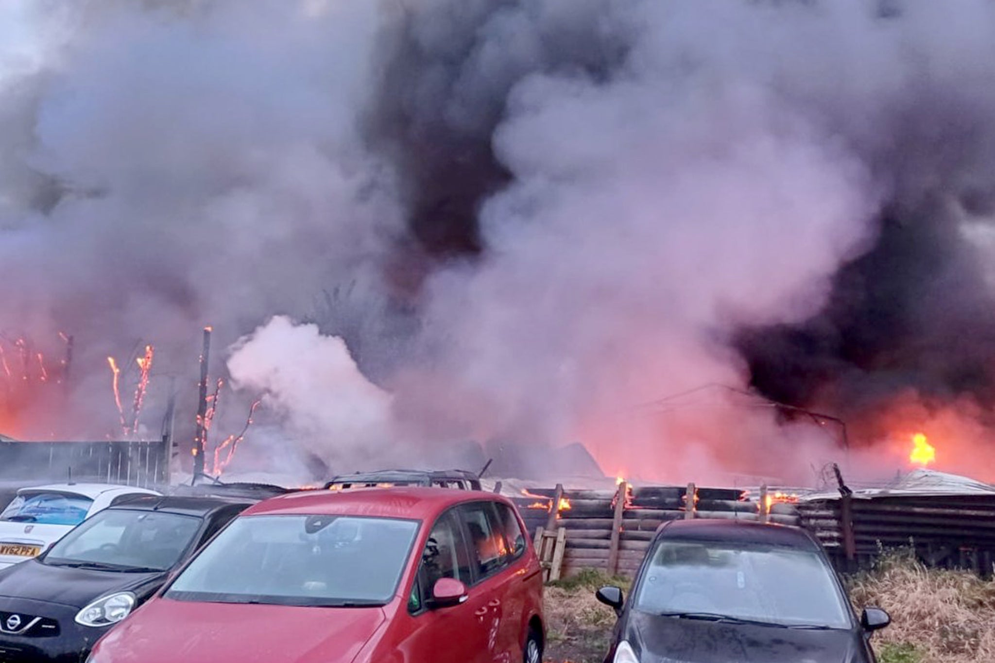 Five cars, one lorry and a single-story outbuilding were involved in the fire
