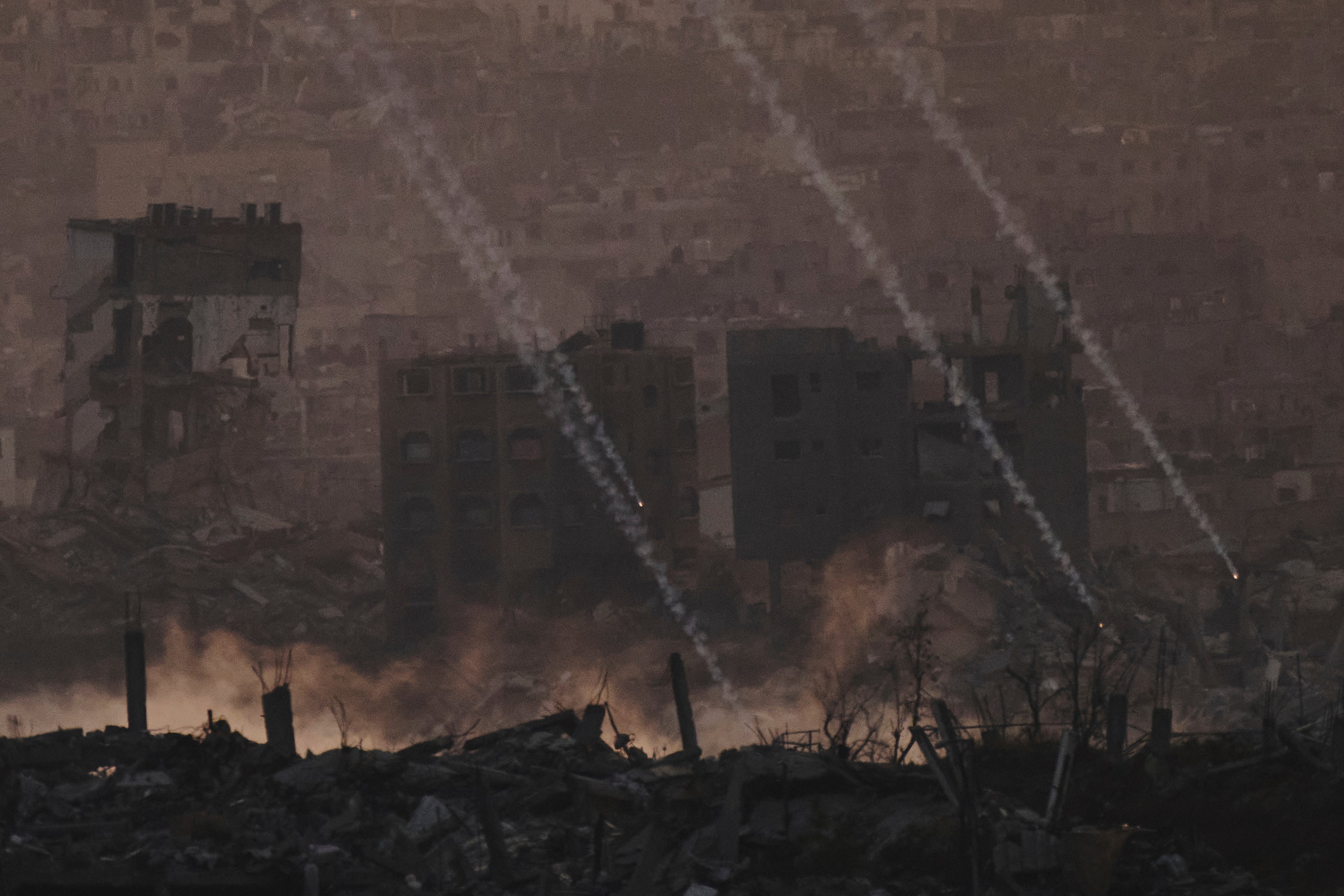 Israeli shelling hits an area in the northern Gaza Strip as seen from southern Israel