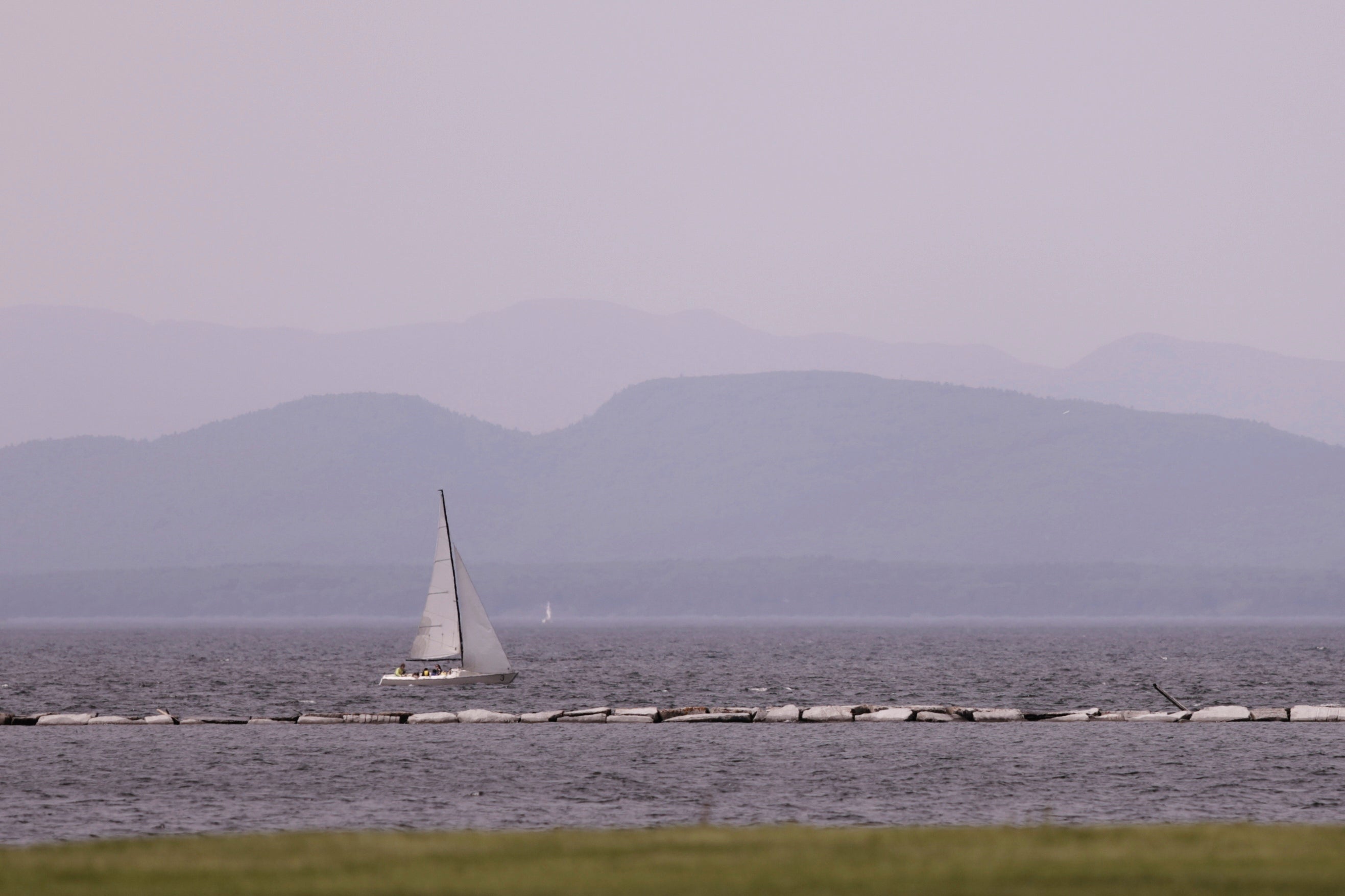 Hazy skies due to smoke from wildfires in Canada are seen over Lake Champlain and the Adirondack Mountains