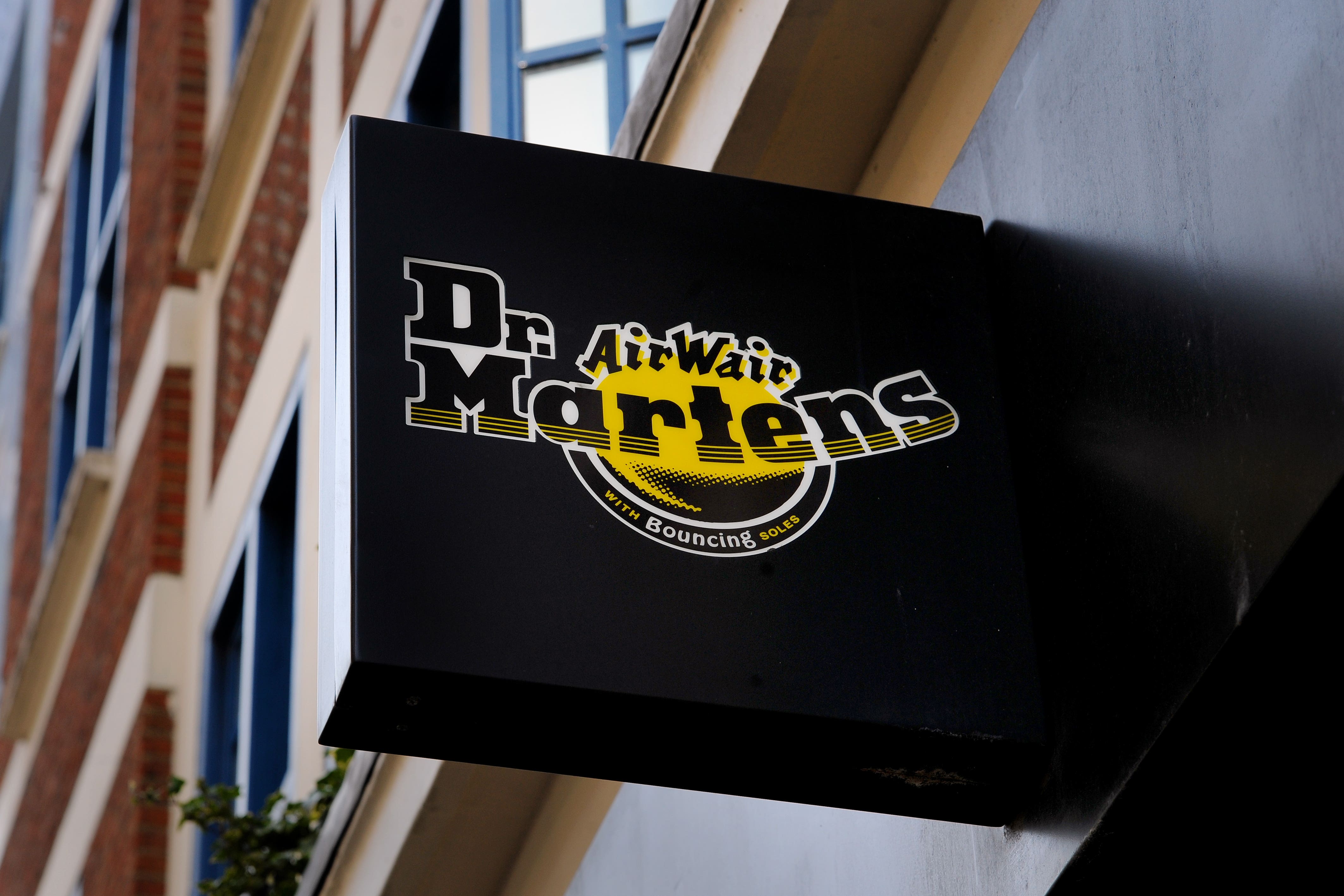 Dr Martens has revealed annual profits slumped as sales came under pressure and it cautioned over ongoing falling revenues in the UK.