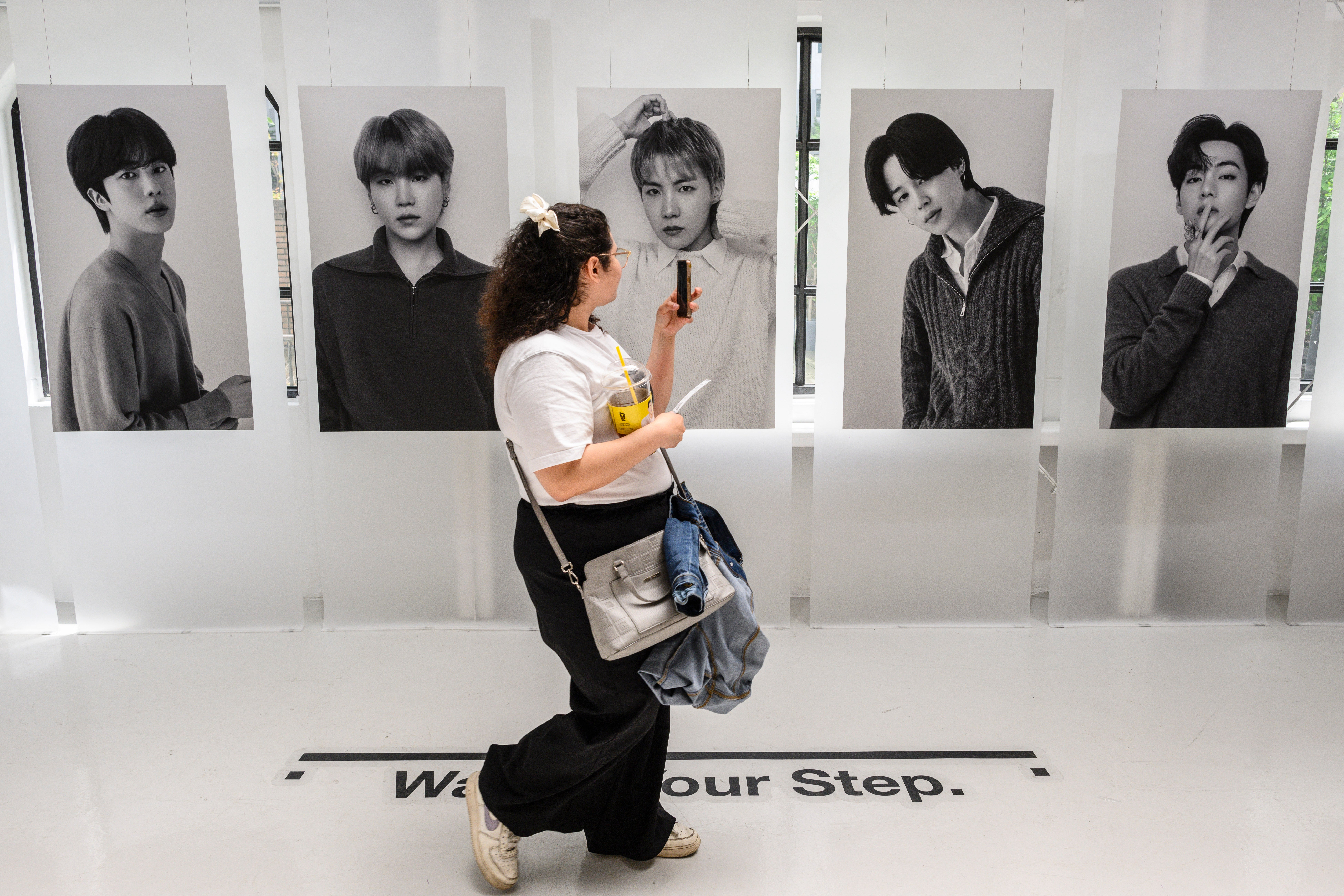 A fan visits a BTS pop-up store BTS in Seoul; Even though a proper comeback as a band isn’t expected until 2026, June is packed with events and solo releases