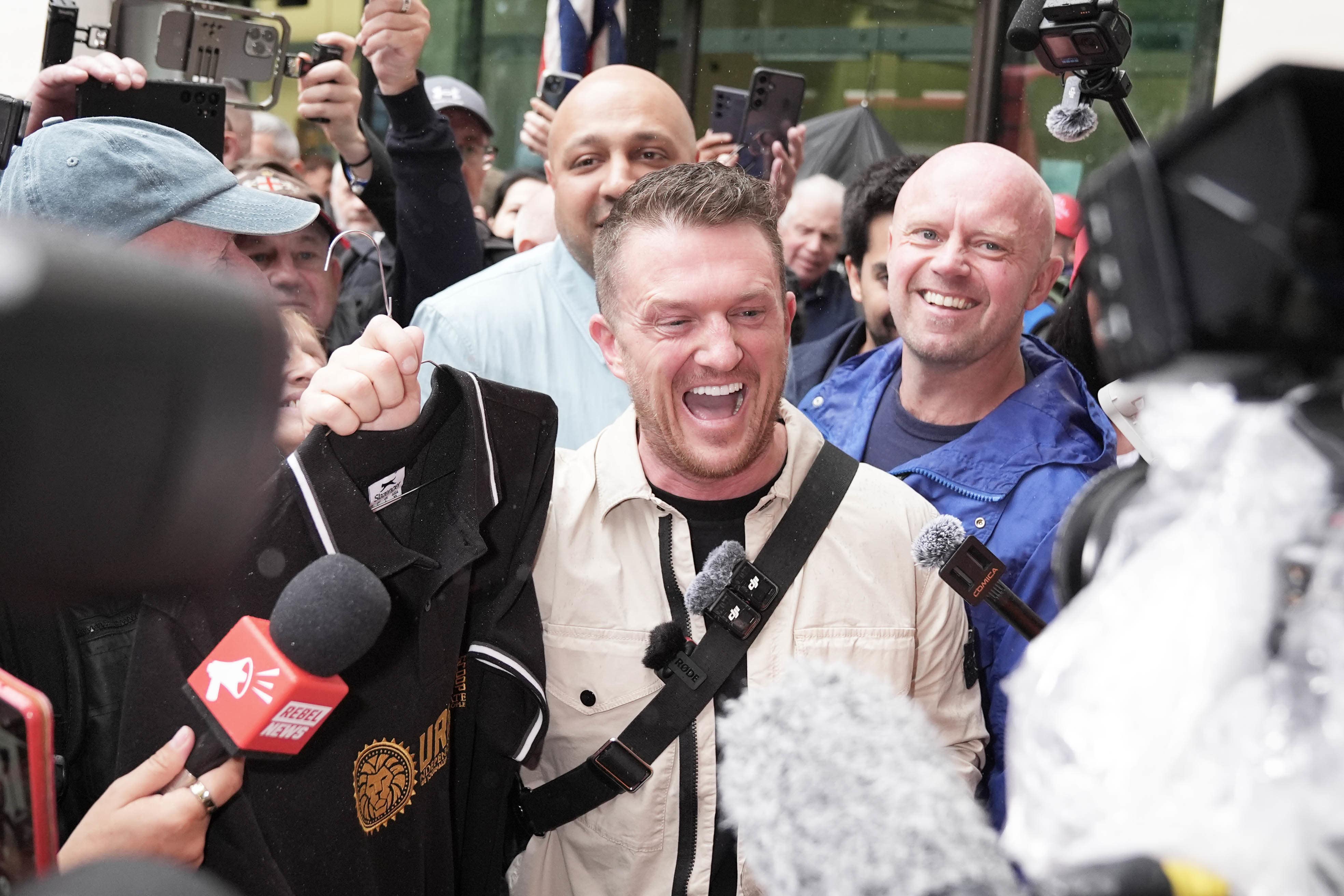 Tommy Robinson (centre), pleaded not guilty to two counts of harassment causing fear of violence (Maja Smiejkowska/PA)