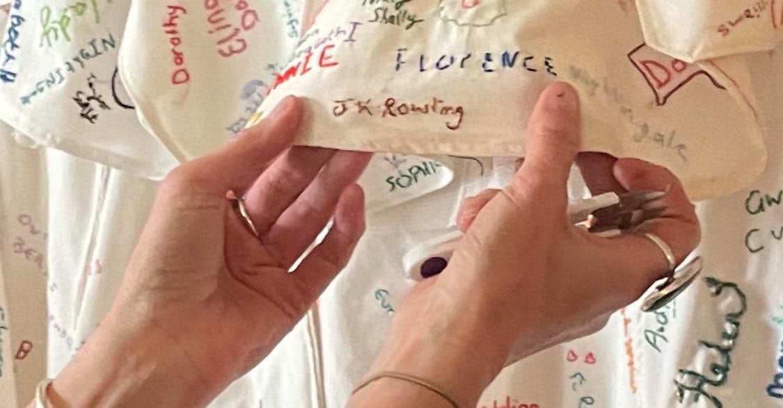 A feminist activist unpicked the stitching covering JK Rowling's name