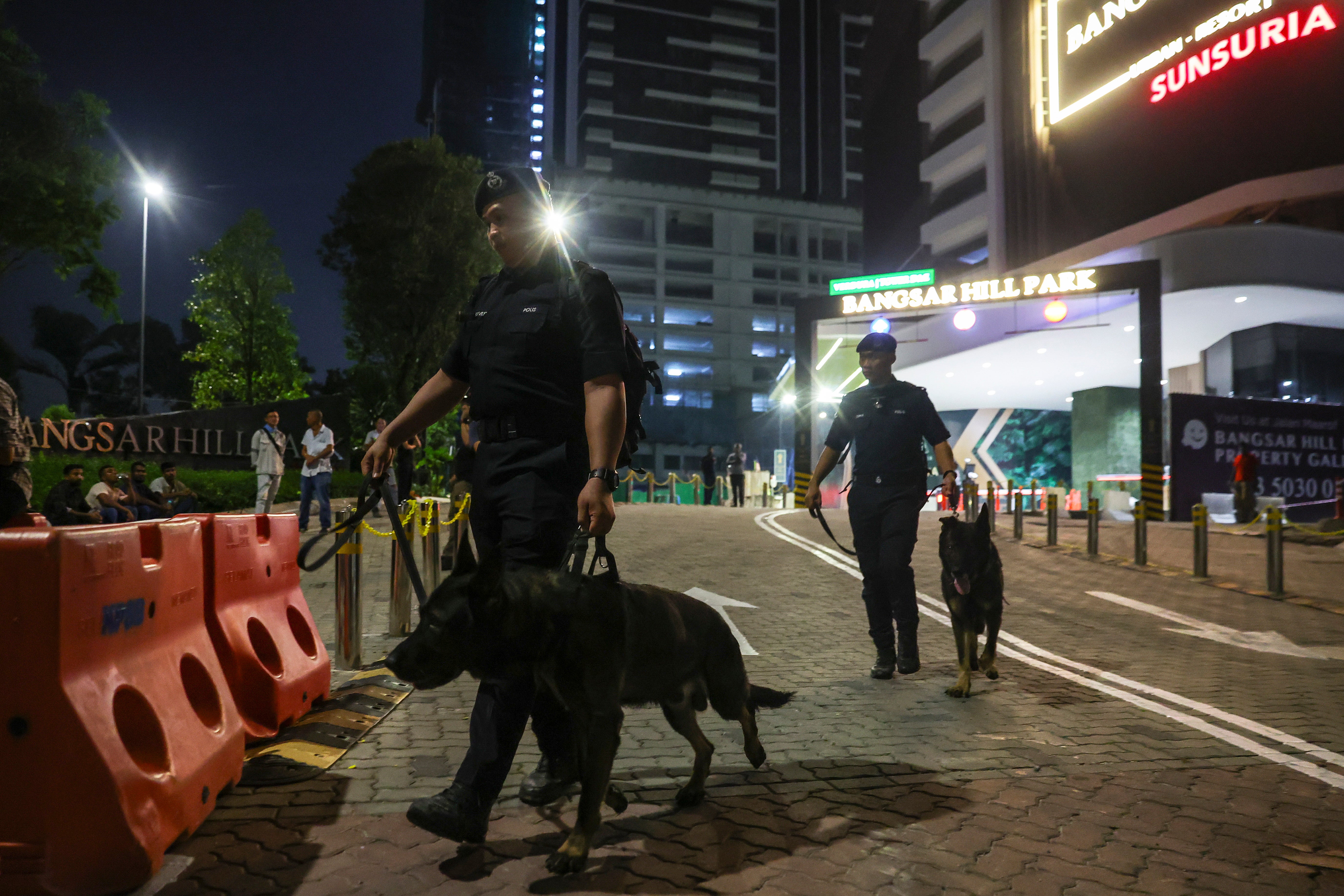 A K9-Unit from the Royal Malaysia Police at the construction site where his body was found