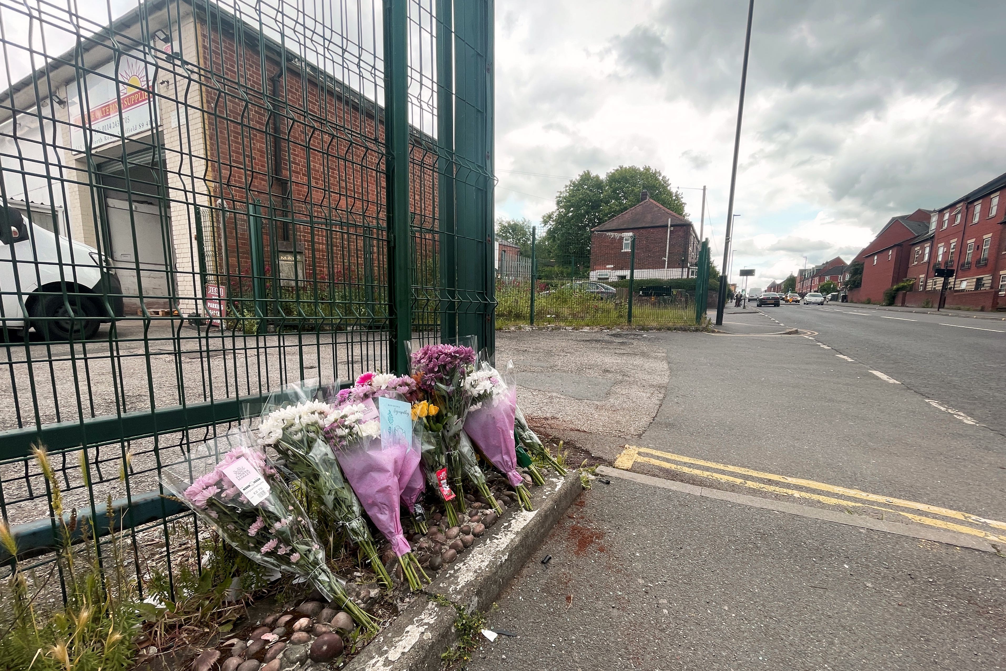 Flowers left at the scene in the Darnall area of Sheffield after a teenage pedestrian died in a collision involving an electric bike and a grey Audi (Dave Higgens/PA)