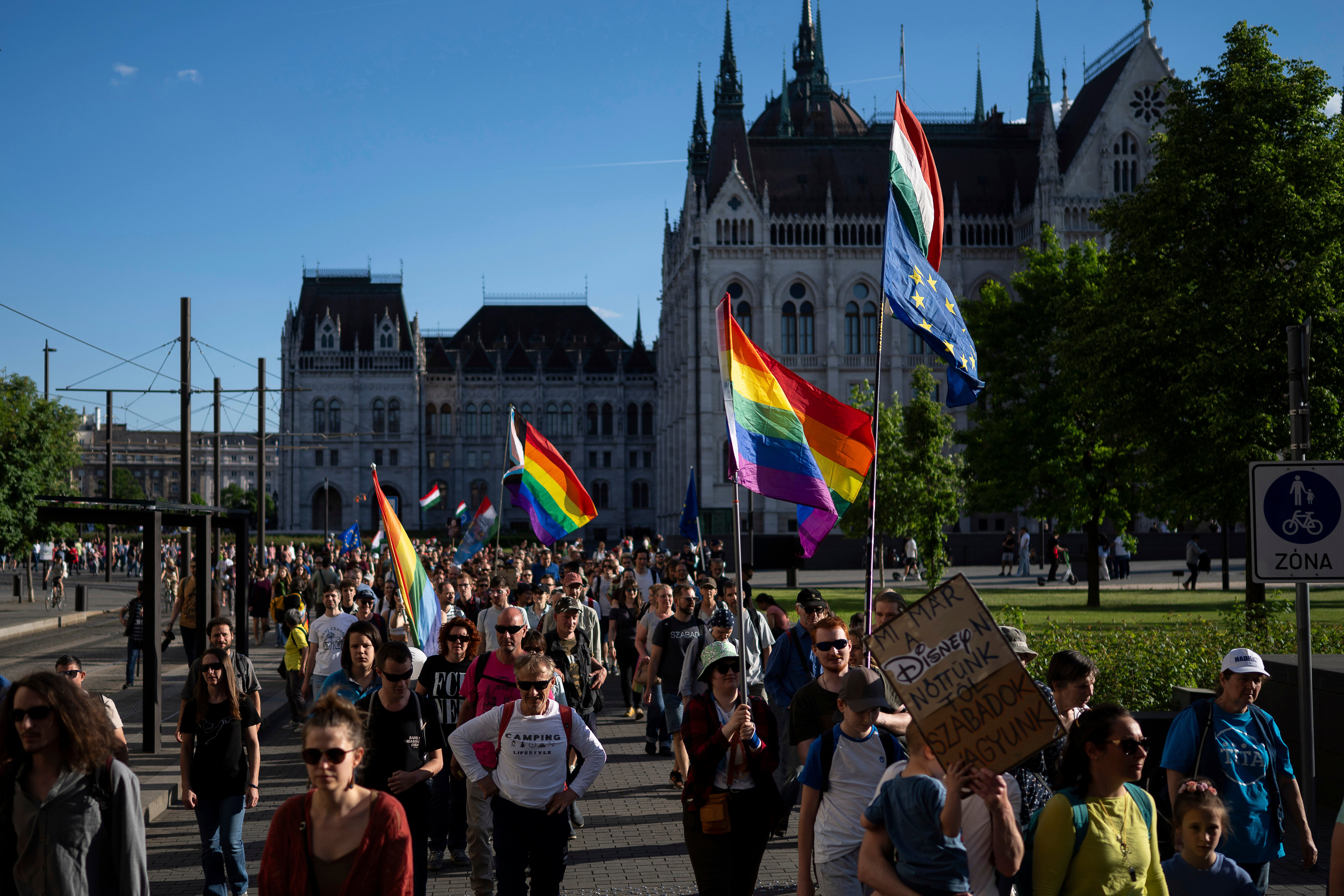 Hungarians march in downtown Budapest to protest against the law banning LGBTQ+ Pride events and the populist government's restriction on assembly rights