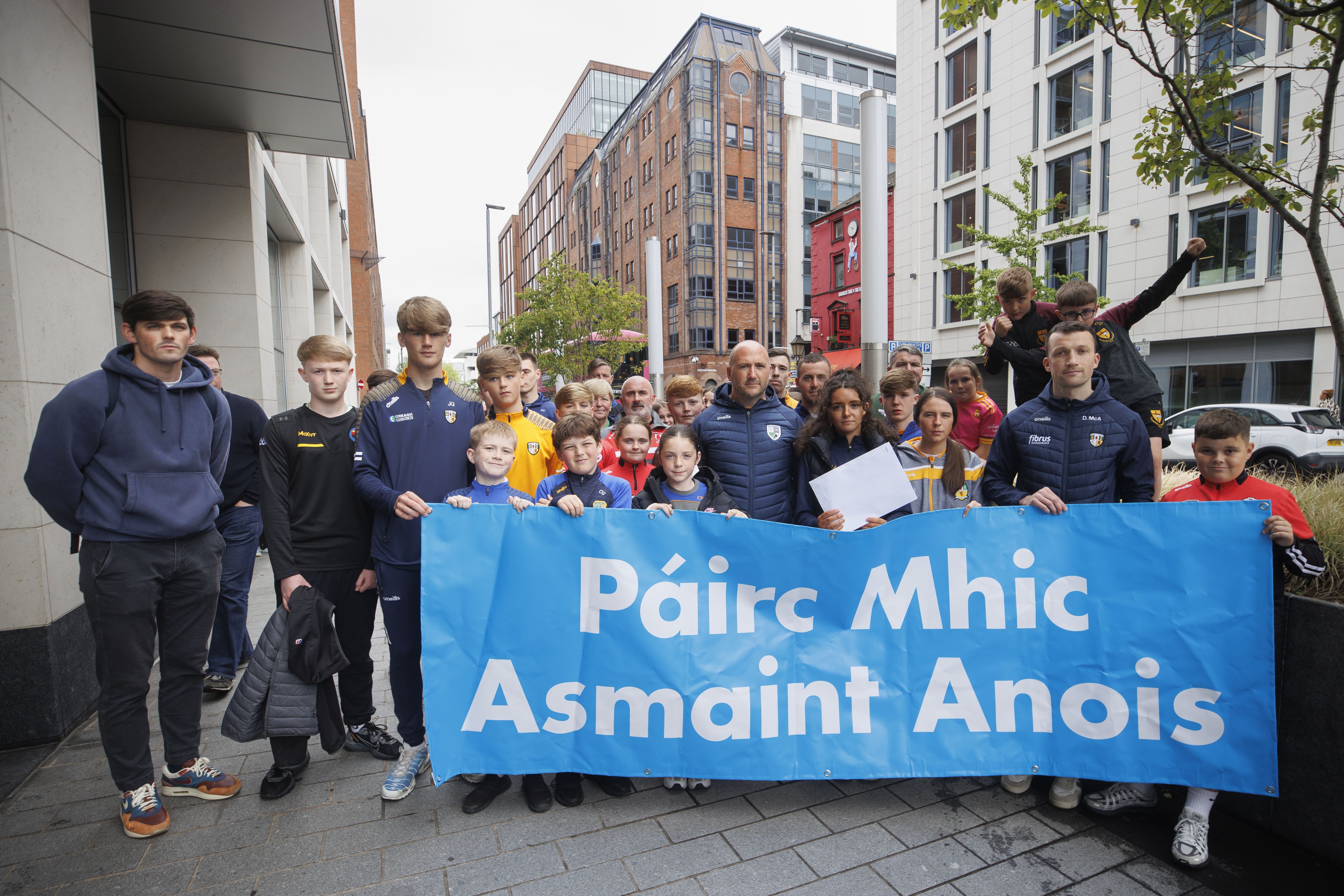 Representatives of South Antrim GAA, including young people from clubs across the county, hand in a letter for Northern Ireland Secretary Hilary Benn at Erskine House in Belfast (Liam McBurney/PA)