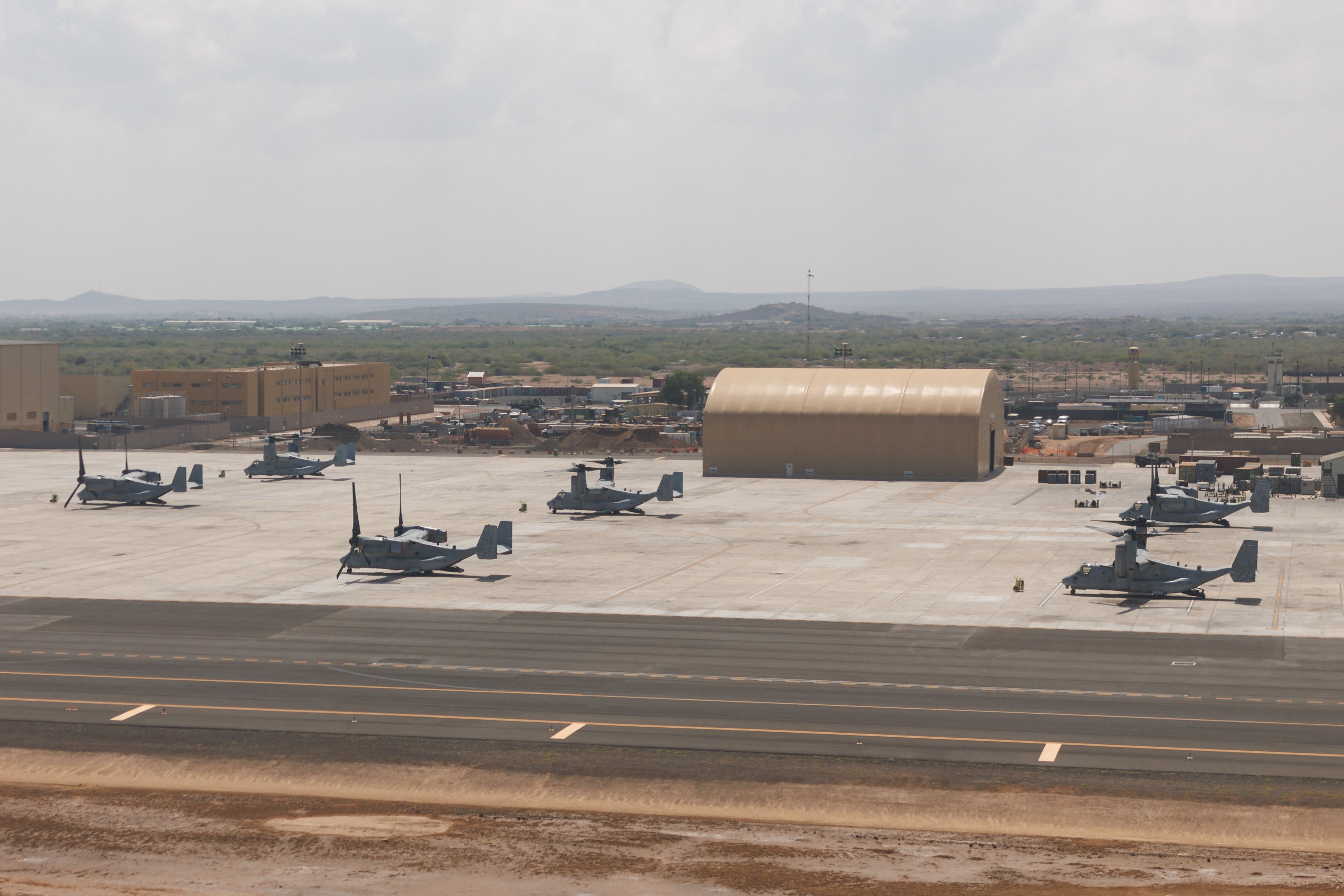 Camp Lemonnier, the only permanent U.S. military base in Africa, is holding a group of deportees the government intends to send to South Sudan. ICE officers there are in tight quarters, at risk of rocket fire, and experiencing symptoms of respiratory infections.