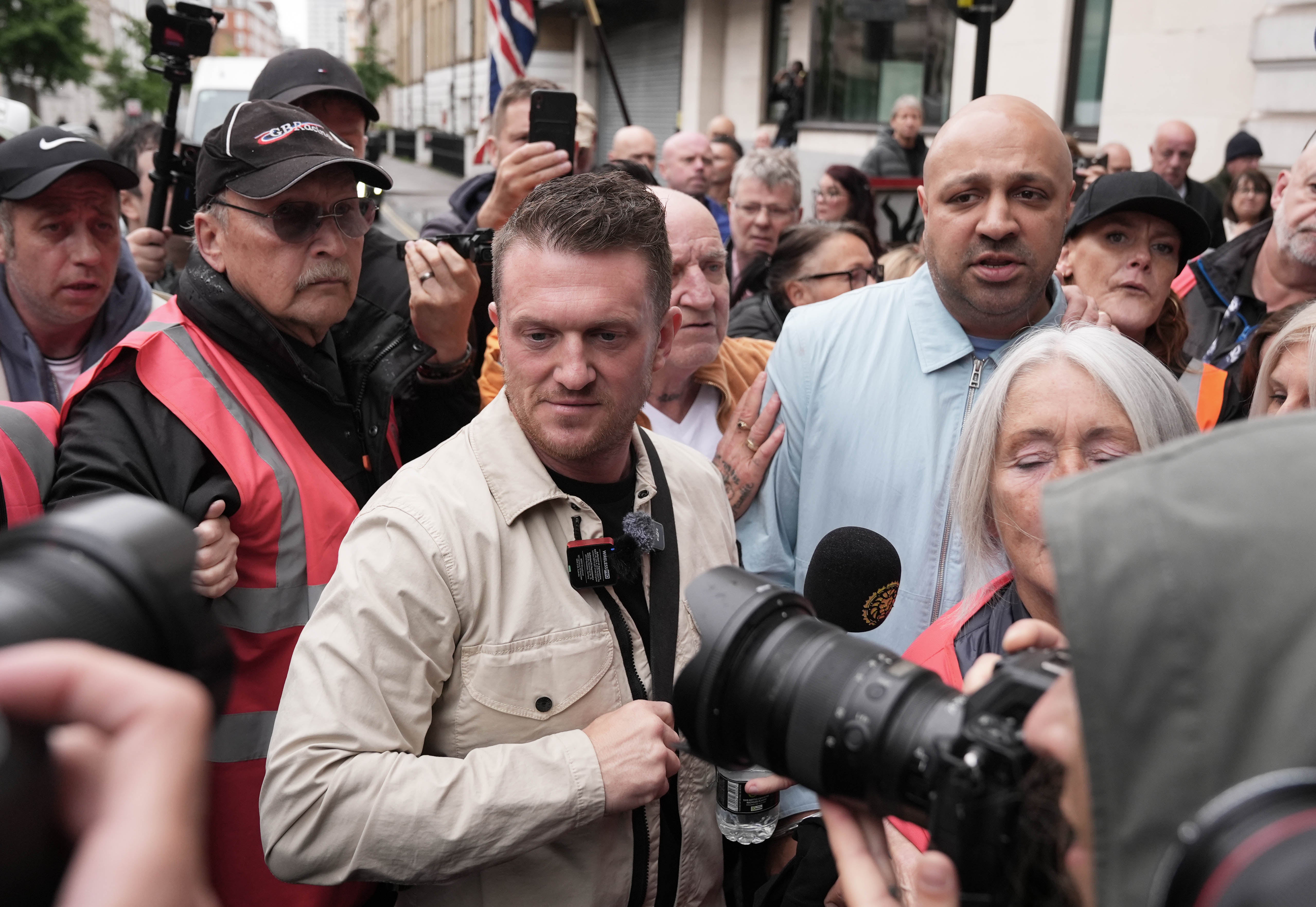 Tommy Robinson (centre), whose real name is Stephen Yaxley-Lennon outside Westminster Magistrates' Court, central London, where he is charged with harassment of two journalists between August 5 and 7 2024