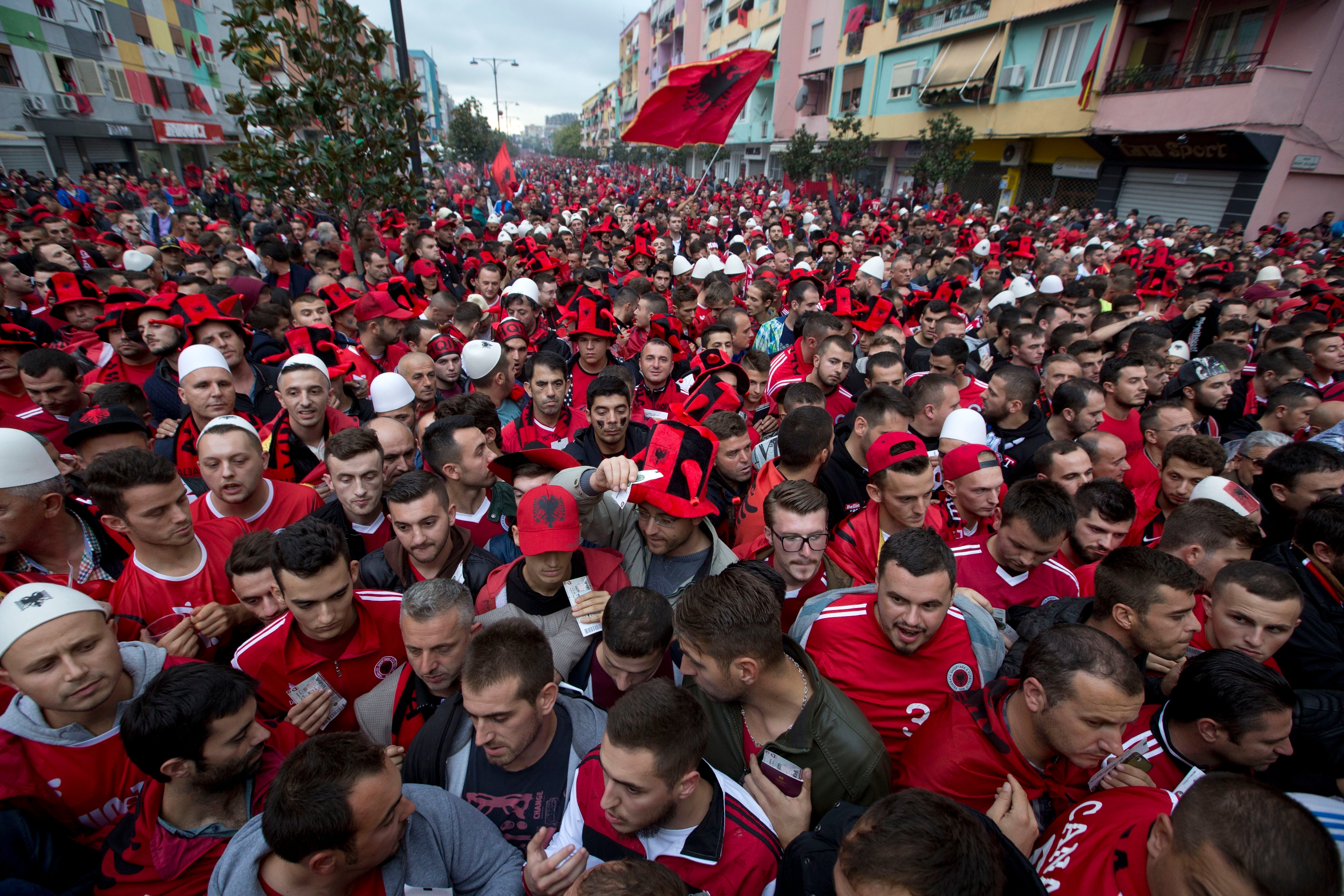 Albania fans wait to be searched by police before Albania and Serbia in Elbasan, central Albania, Oct. 8, 2015