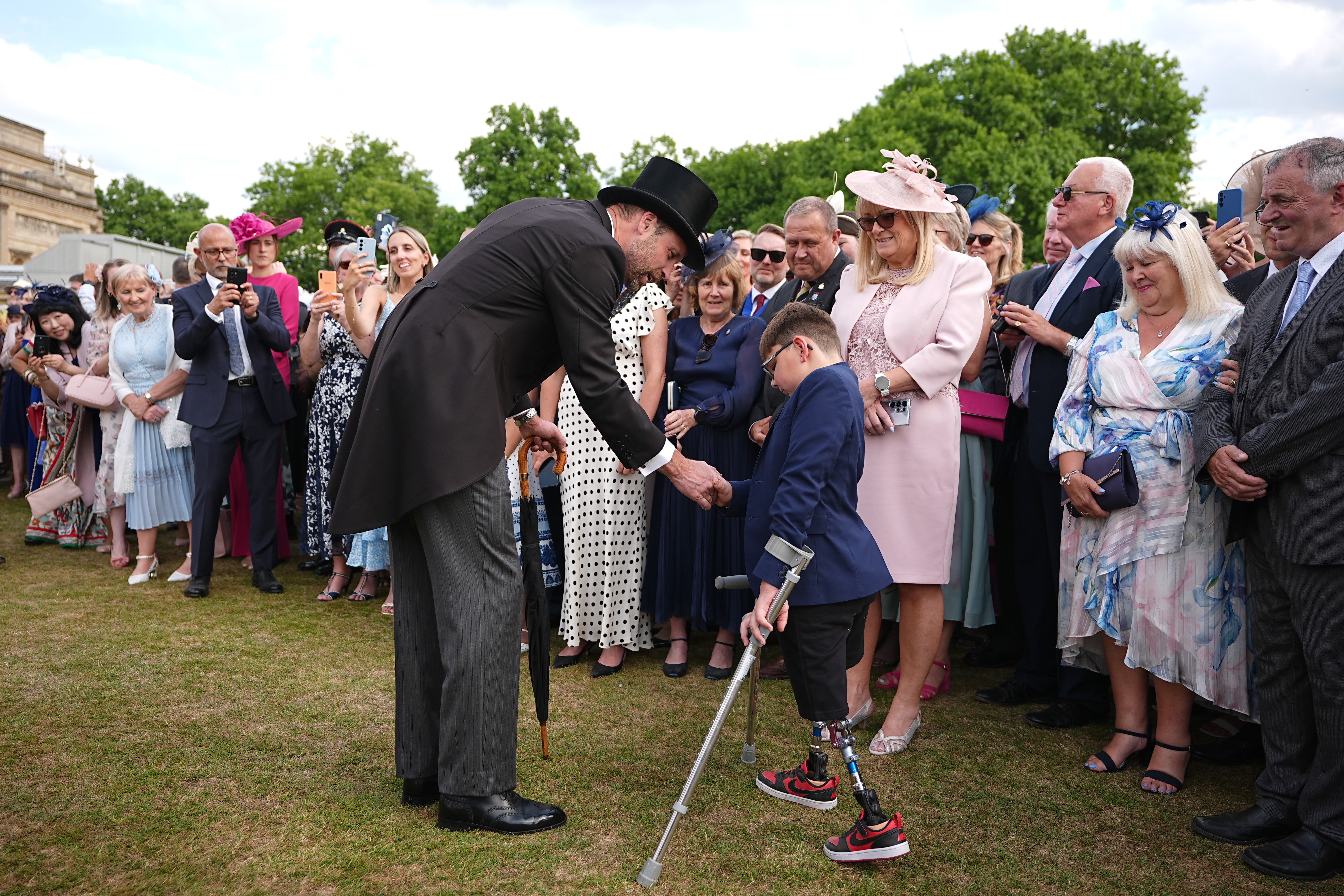 The Prince of Wales meets Tony Hudgell during a Royal Garden Party at Buckingham Palace (PA)