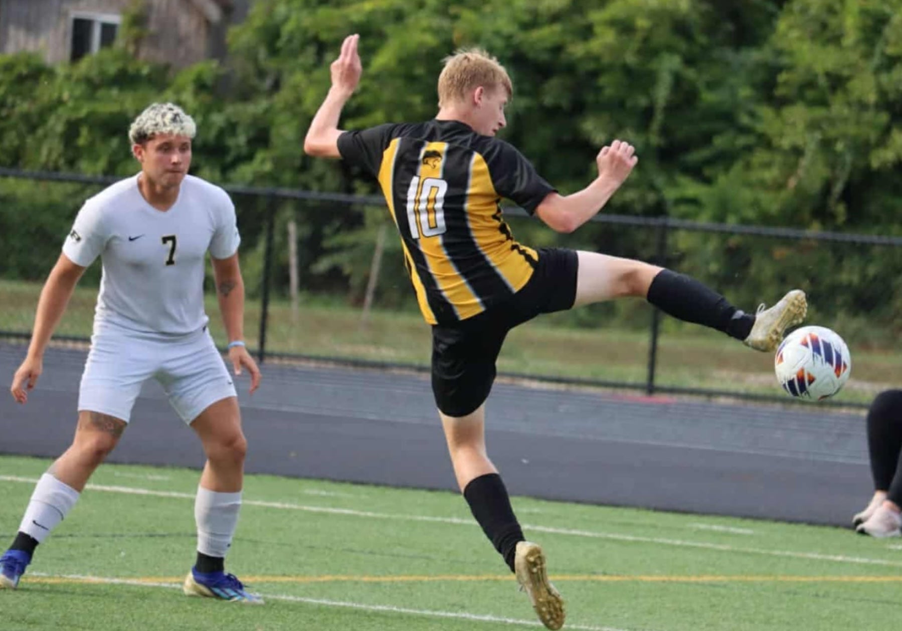 Labrador-Sierra (L) played soccer for Perrysburg High School’s junior varsity team. He is pictured playing against a 15-year-old Northview High School student last year. Other professional pictures of him competing in school sports remain online.