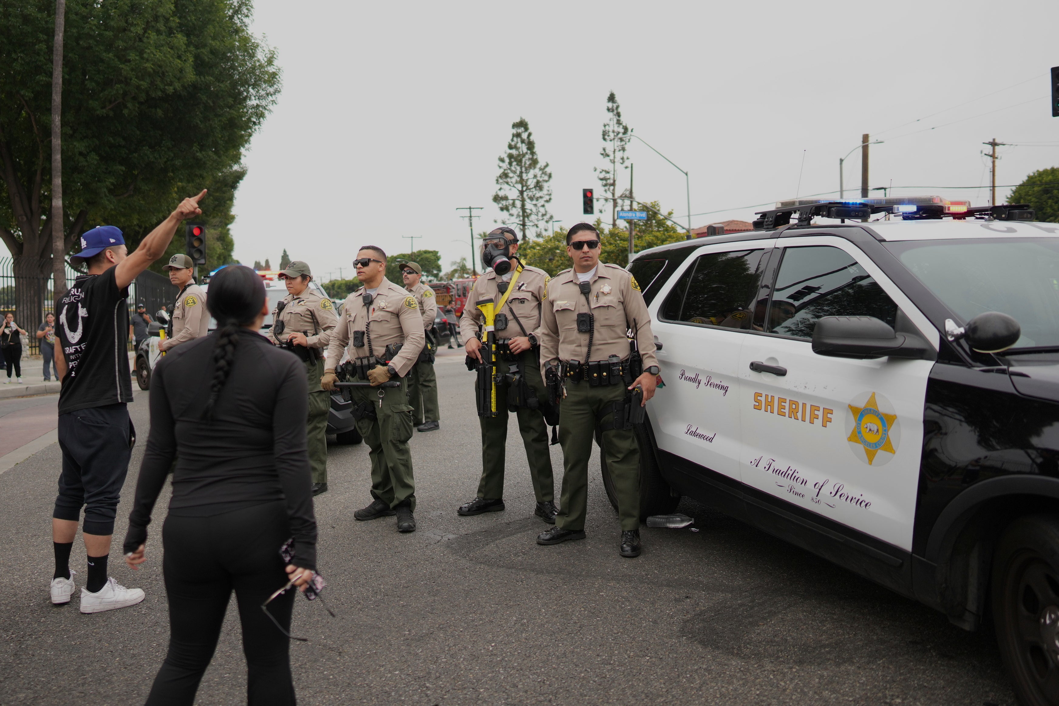 Protesters confront sheriff’s officers in the Paramount section of L.A.