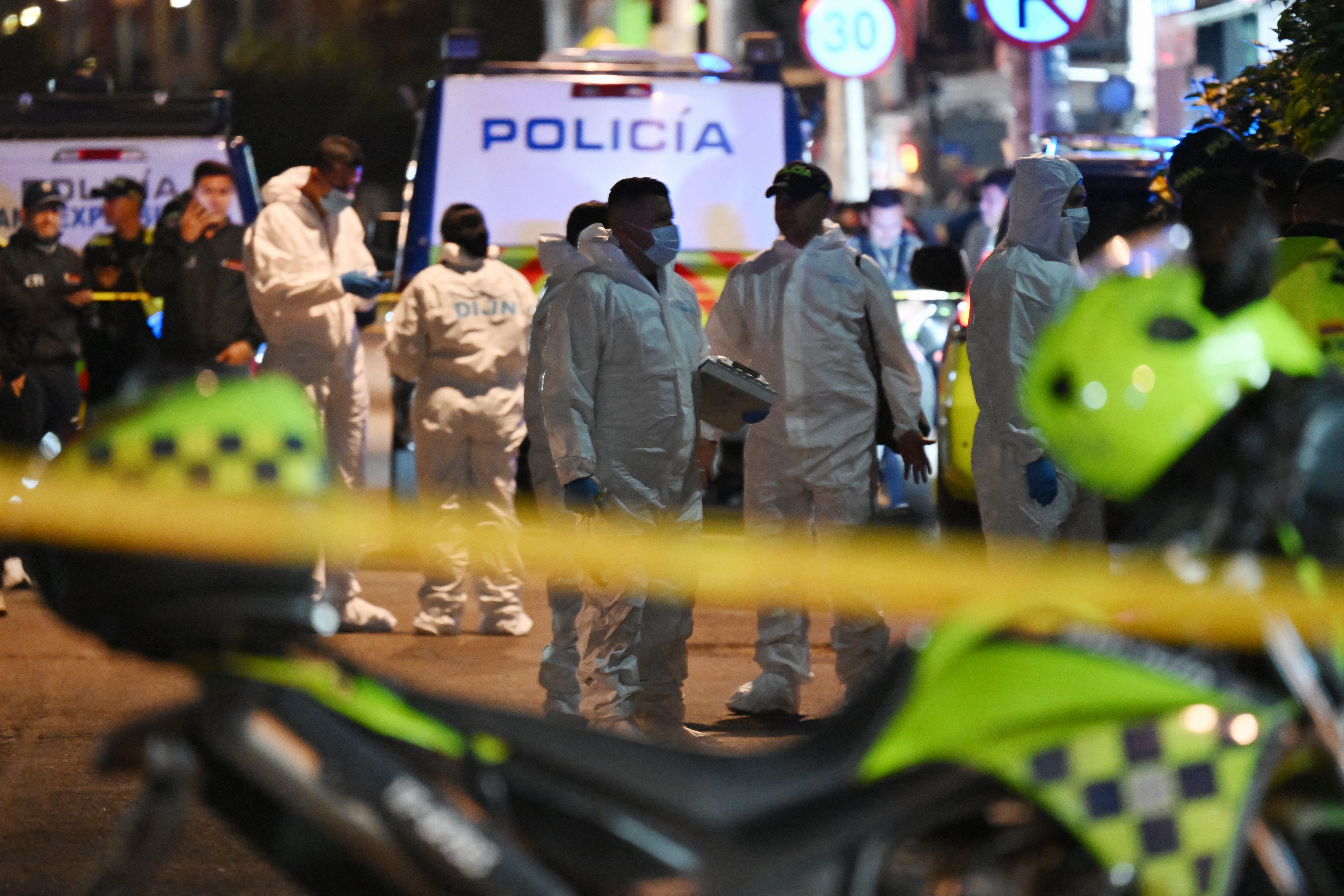 Forensic experts work at the crime scene where Senator Miguel Uribe Turbay was shot and wounded in Bogota