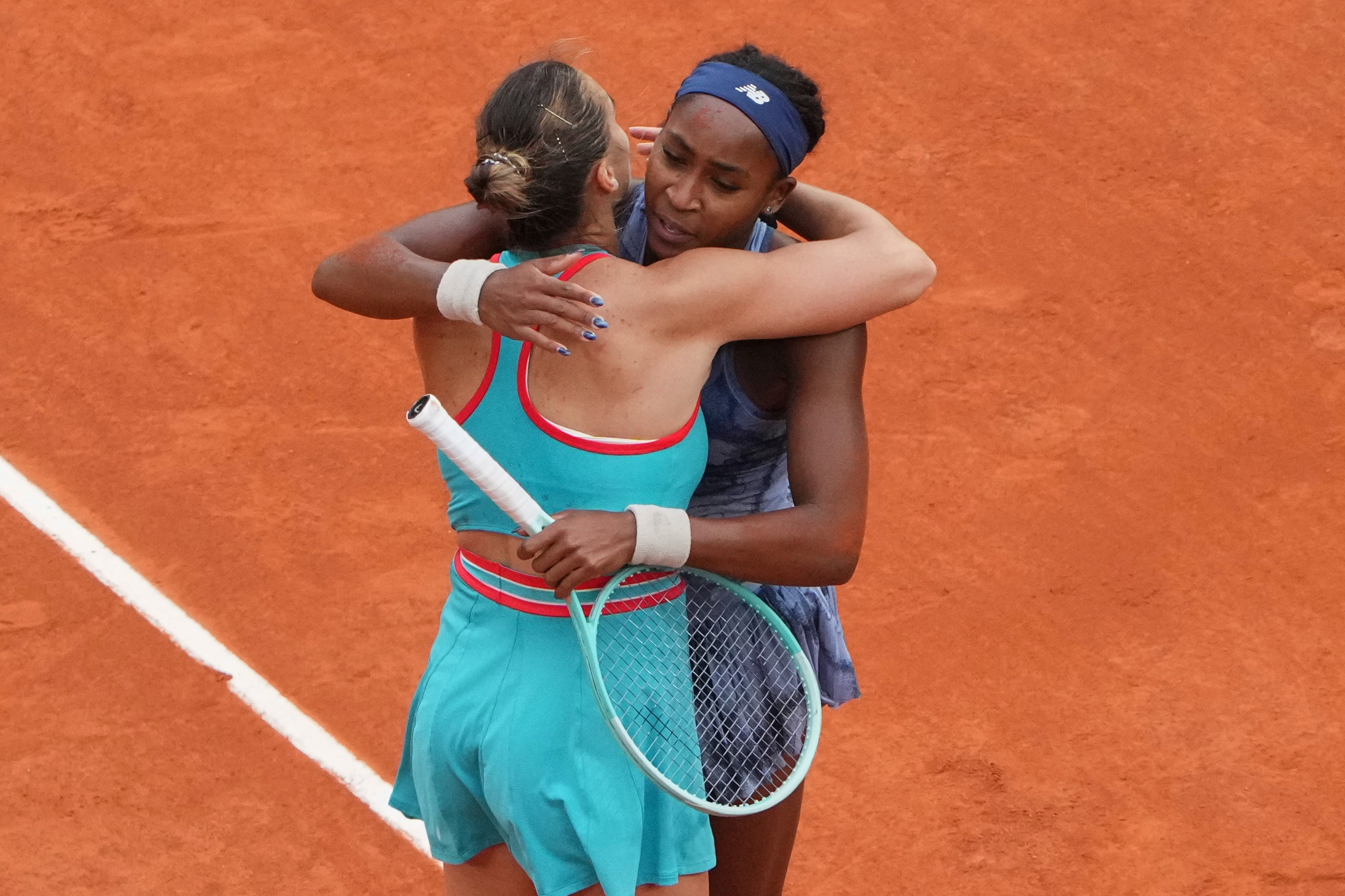 Coco Gauff hugs Aryna Sabalenka after their match