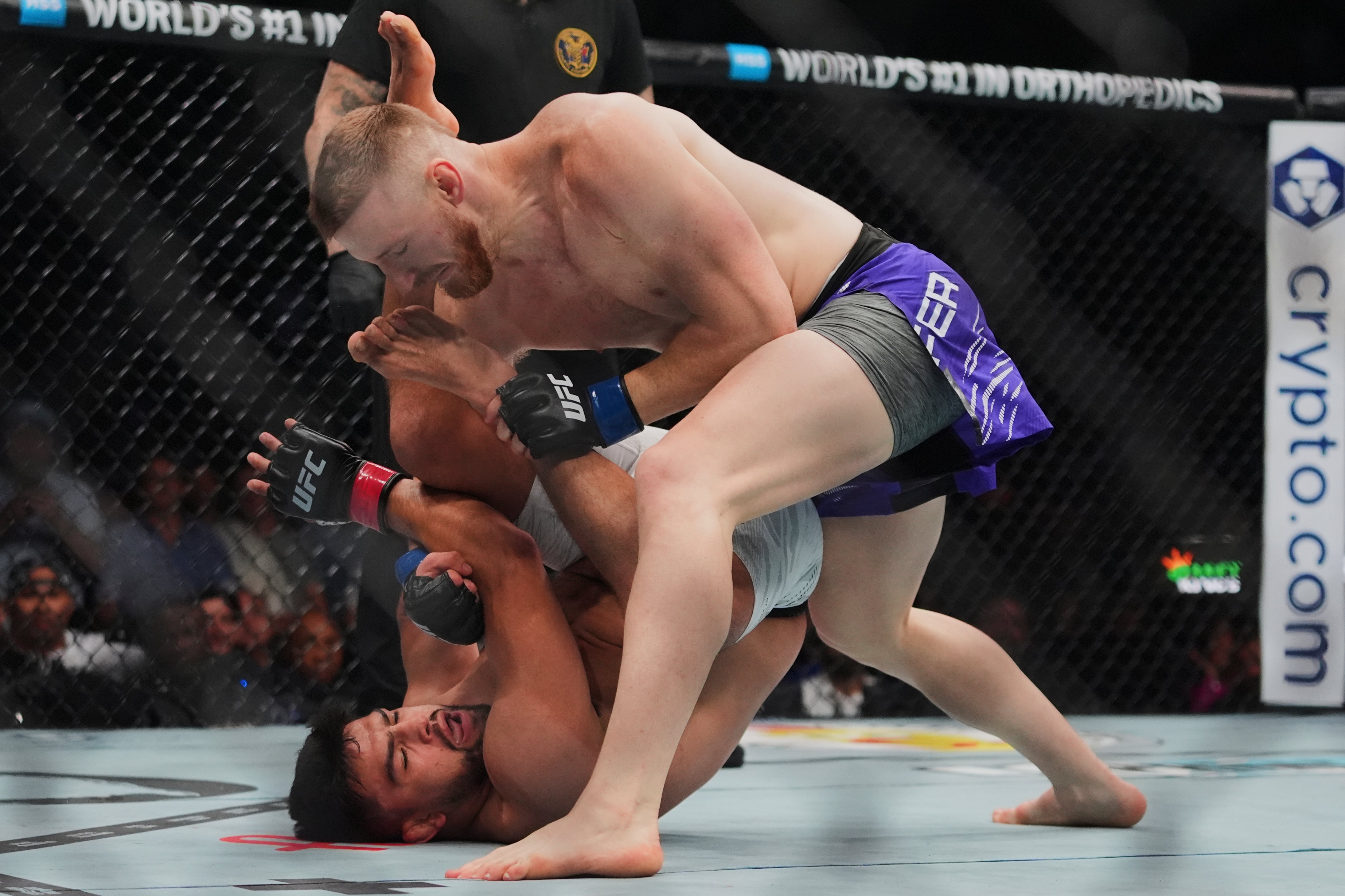 Joe Pyfer (top) outpointed Kelvin Gastelum, a former opponent of Adesanya, last June