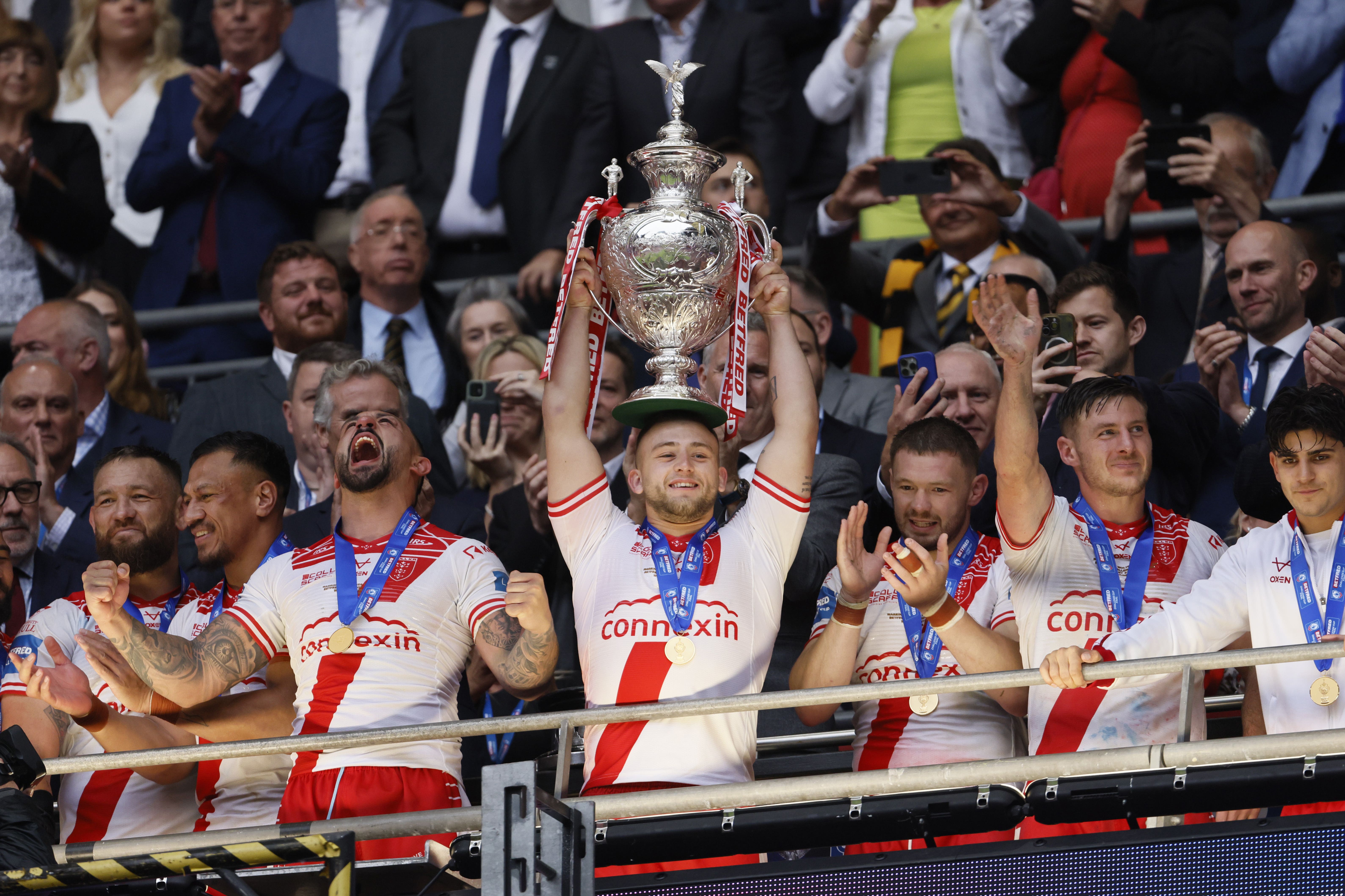 Hull KR’s Mikey Lewis lifts the trophy after his side’s dramatic Challenge Cup final triumph (Richard Sellers/PA).