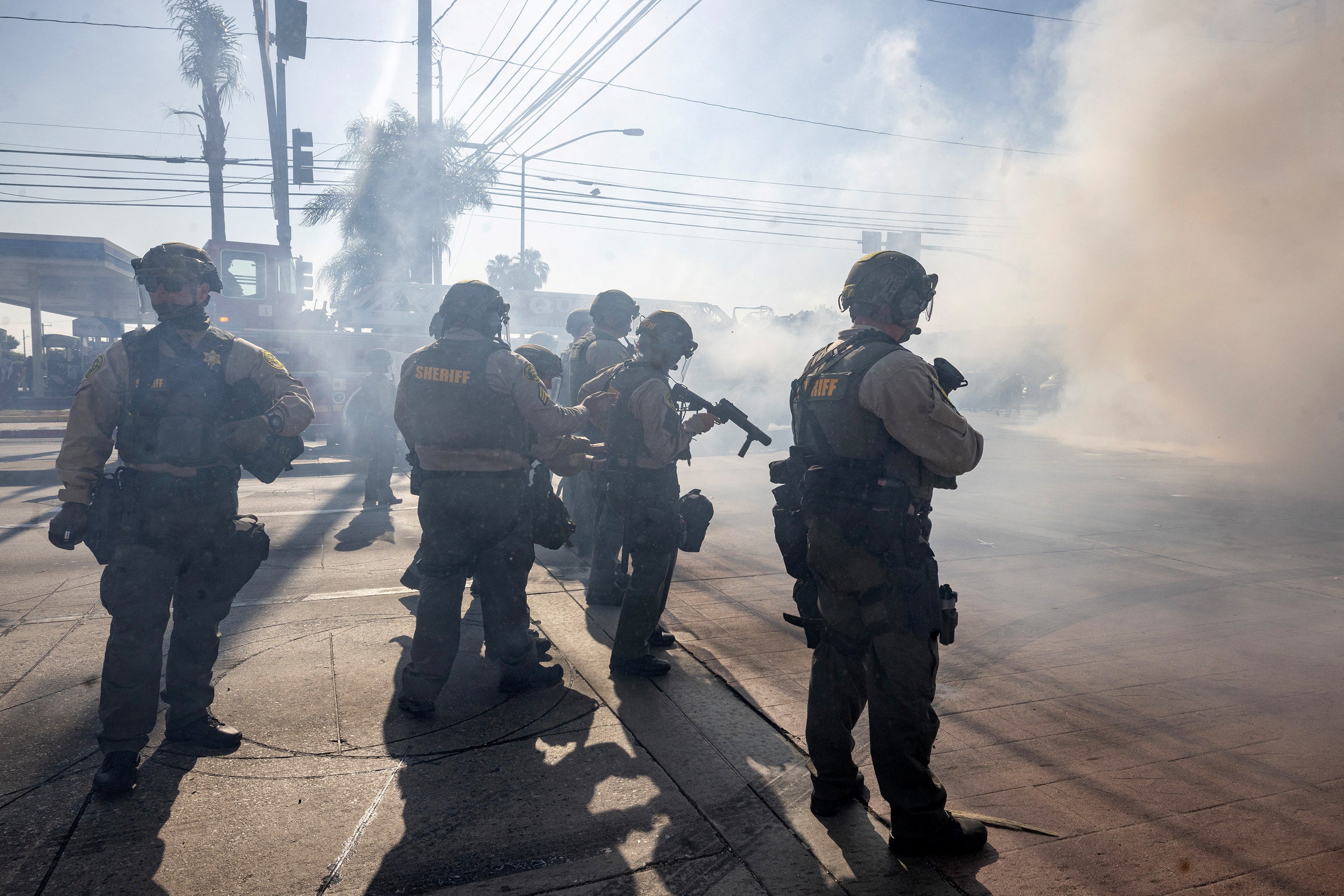 Los Angeles County Sheriff deputies stand guard, during a standoff by protesters and law enforcement following multiple detentions by Immigration and Customs Enforcement (ICE), in the Los Angeles County city of Paramount, California, U.S., June 7, 2025