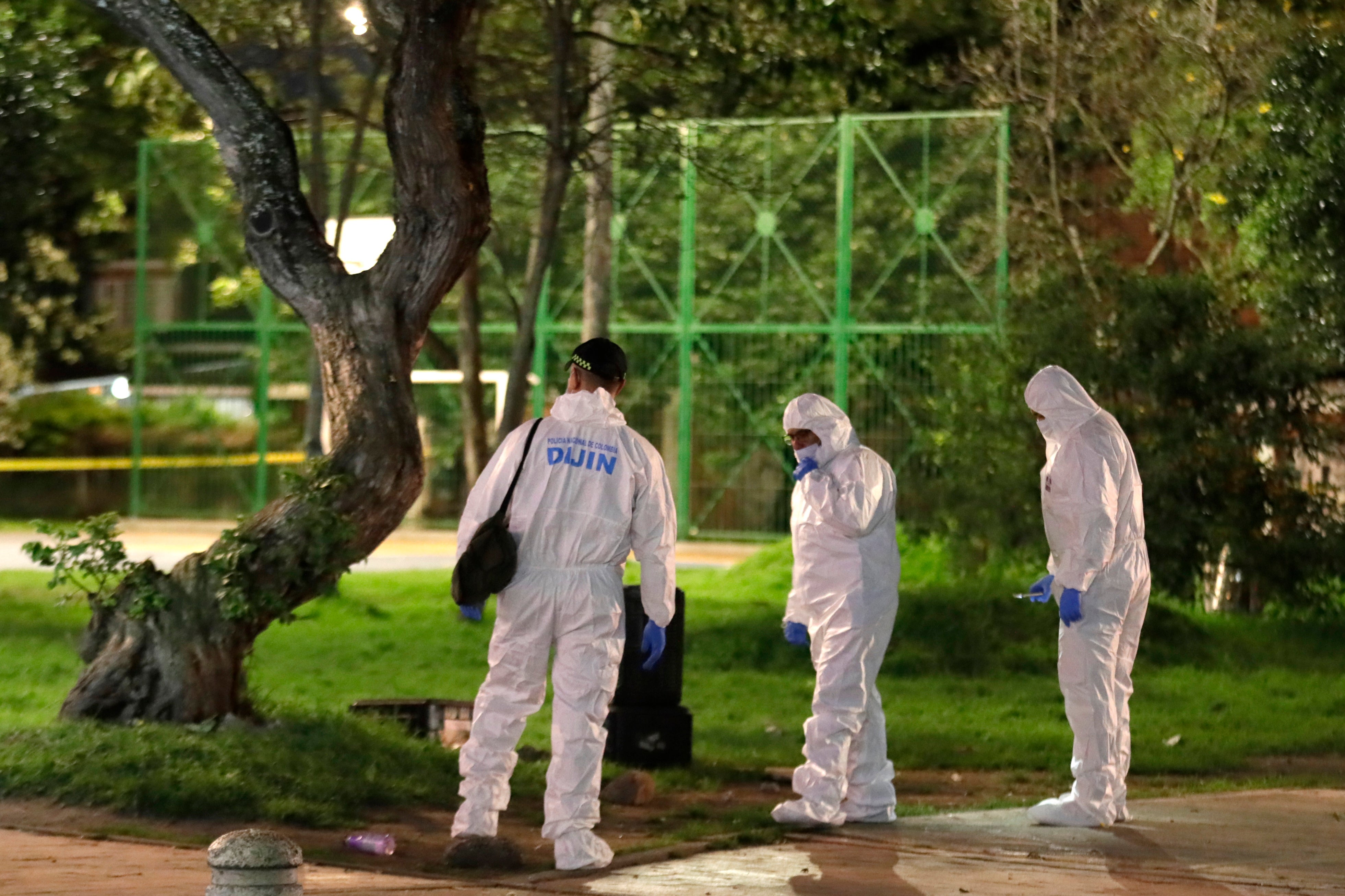 Forensics officers collecting evidence at the scene of the shooting