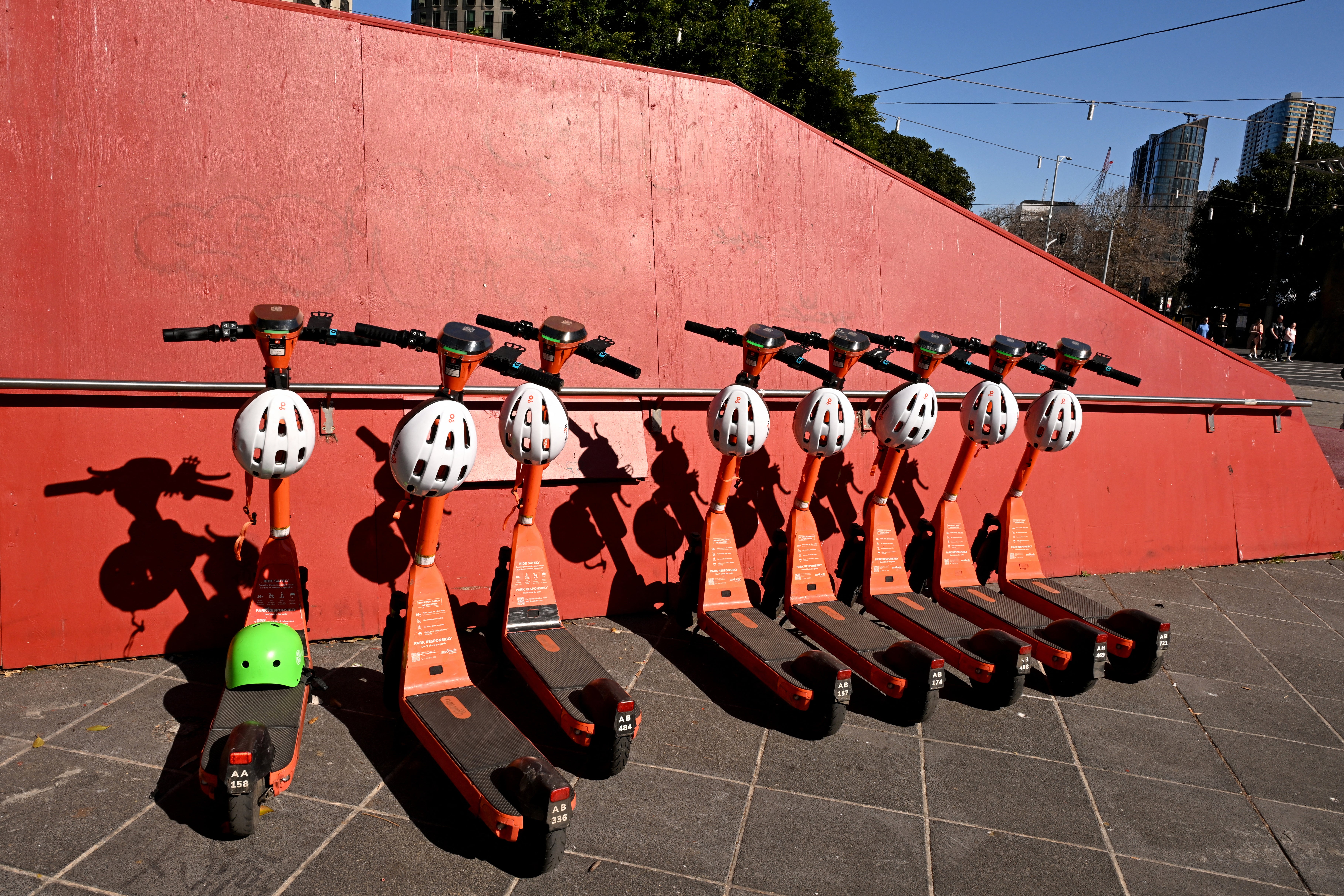 Hire e-scooters are lined up in Melbourne's central business district
