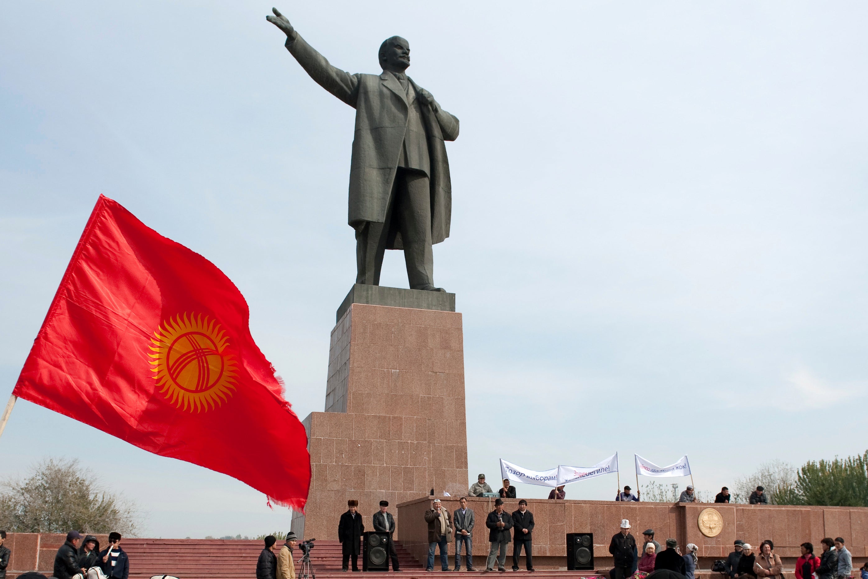 Protesters rally in front of a statue of Soviet Union founder Vladimir Lenin on a central square in the southern Kyrgyz city of Osh, Kyrgyzstan, on Thursday, Nov. 3, 2011. (AP Photo/Nicolas Tanner, File)