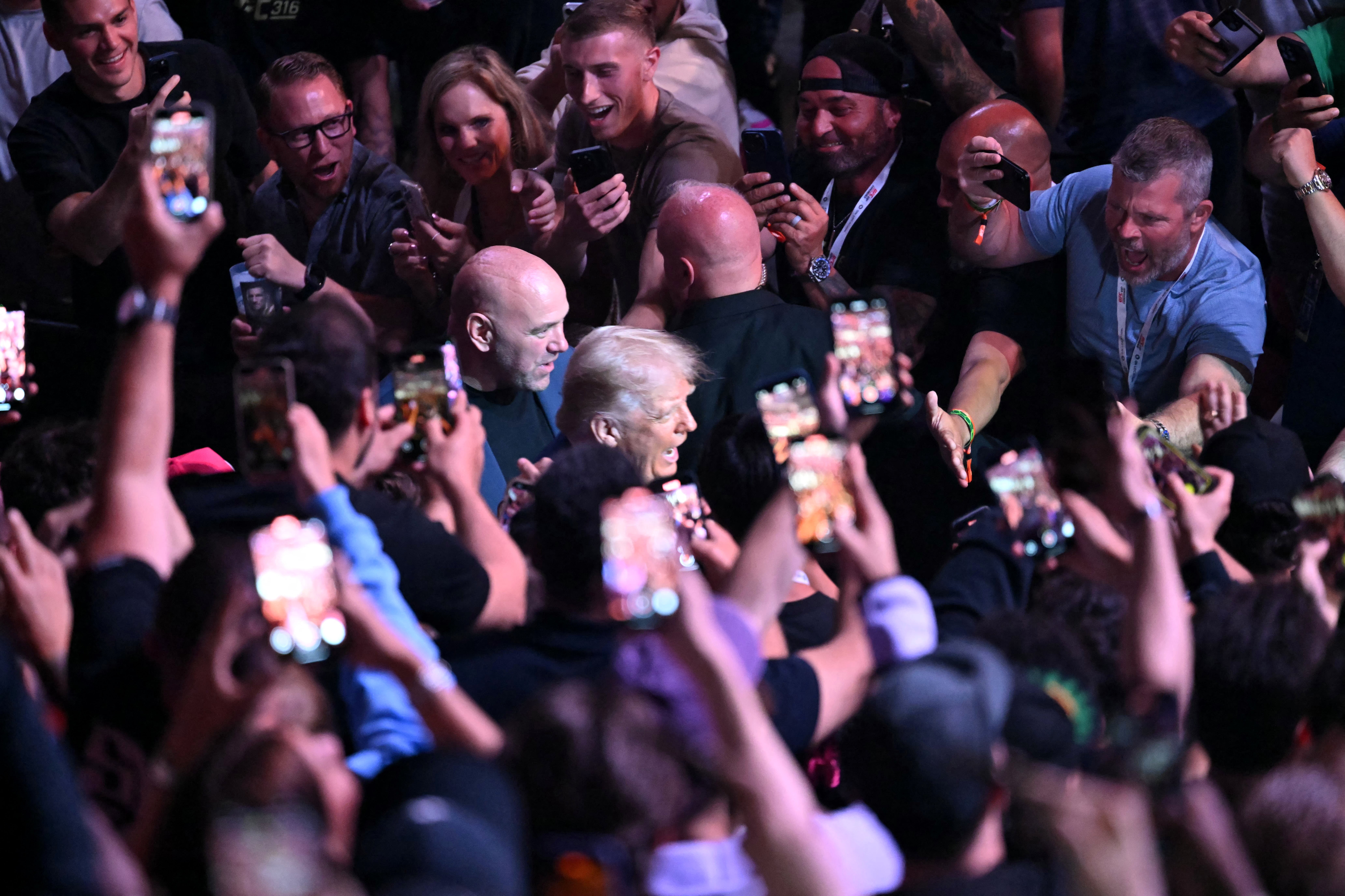 Trump arrives at the Prudential Center in Newark, New Jersey for a UFC fight between Merab Dvalishvili and Sean O'Malley. Shortly earlier he had ordered 2,000 National Guardsmen into Los Angeles