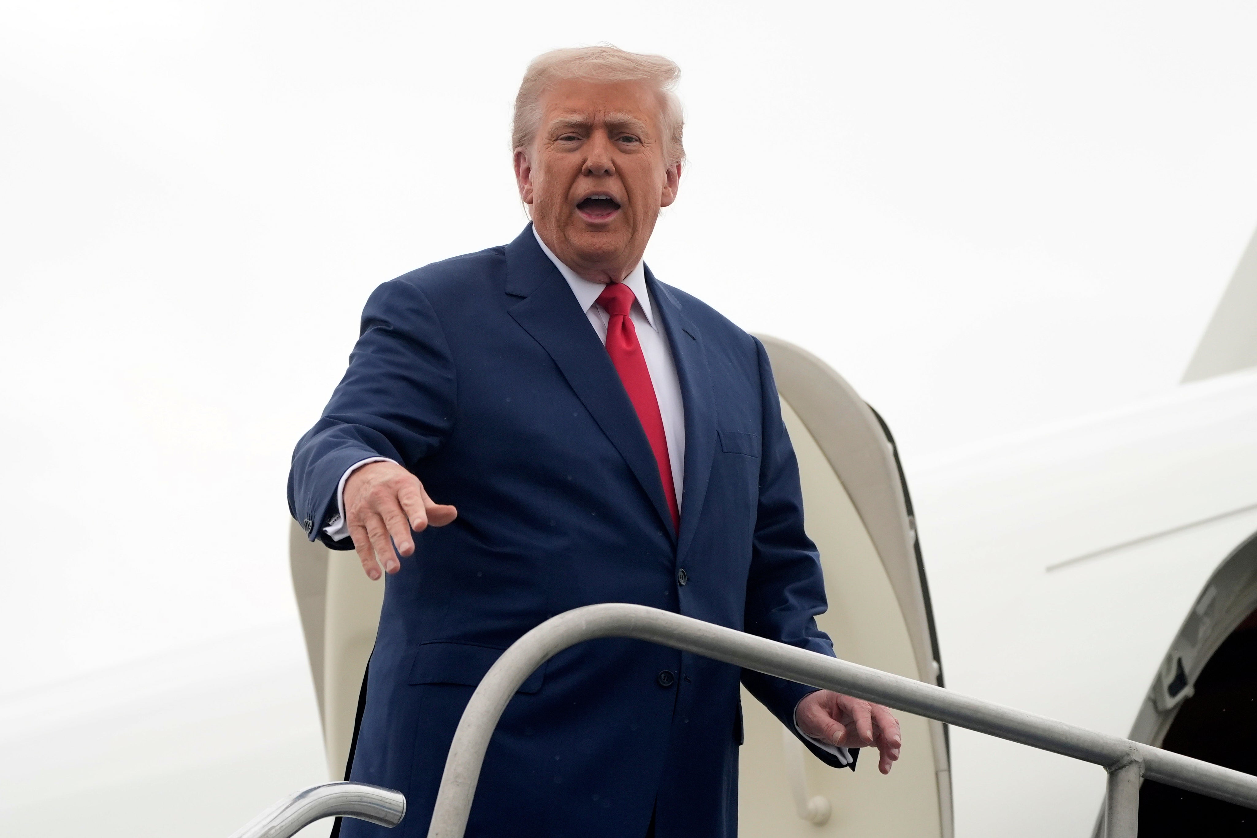 Trump boarded the plane on his way to Camp David
