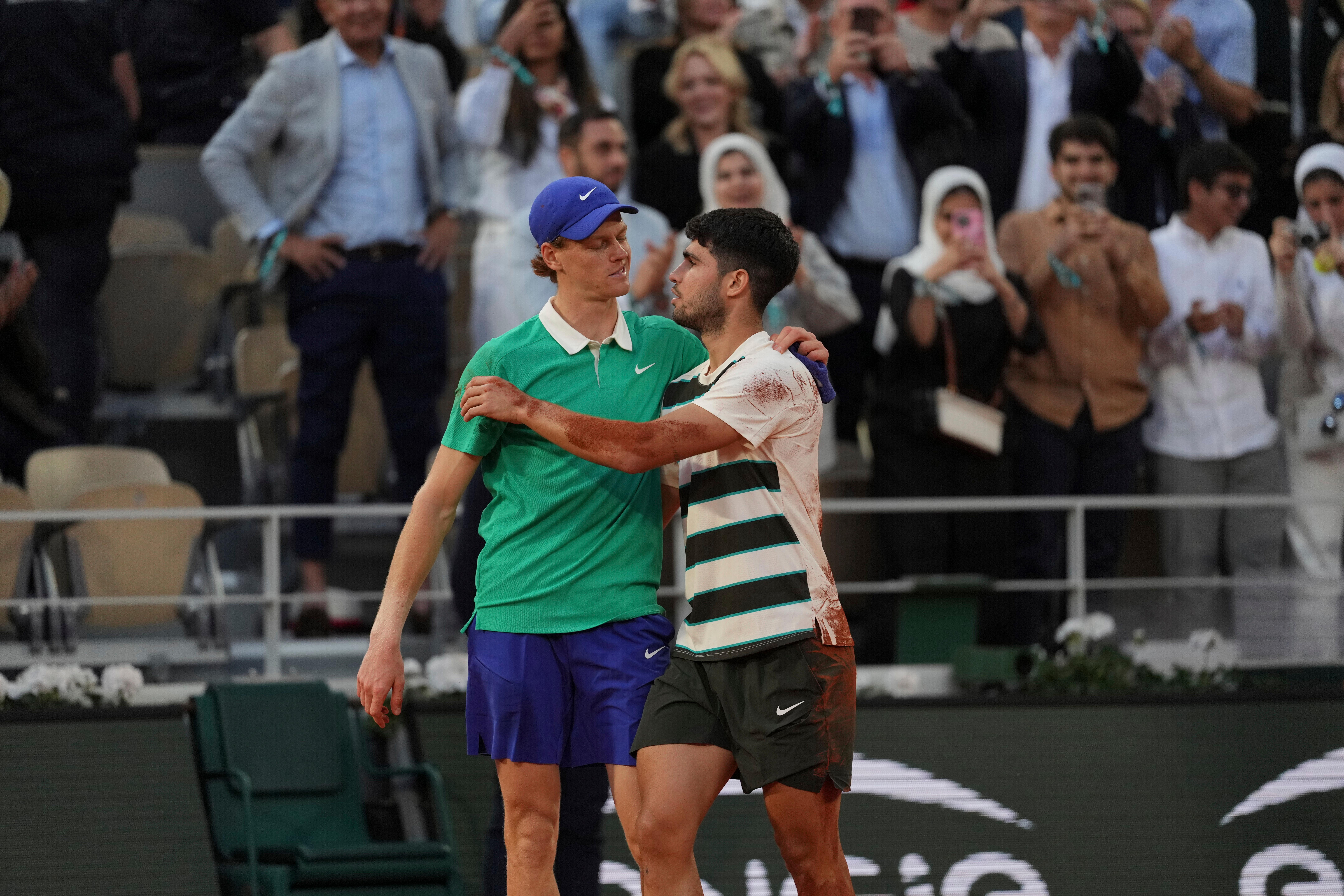 Carlos Alcaraz (right) beat Jannik Sinner in a marathon final (Thibault Camus/AP)