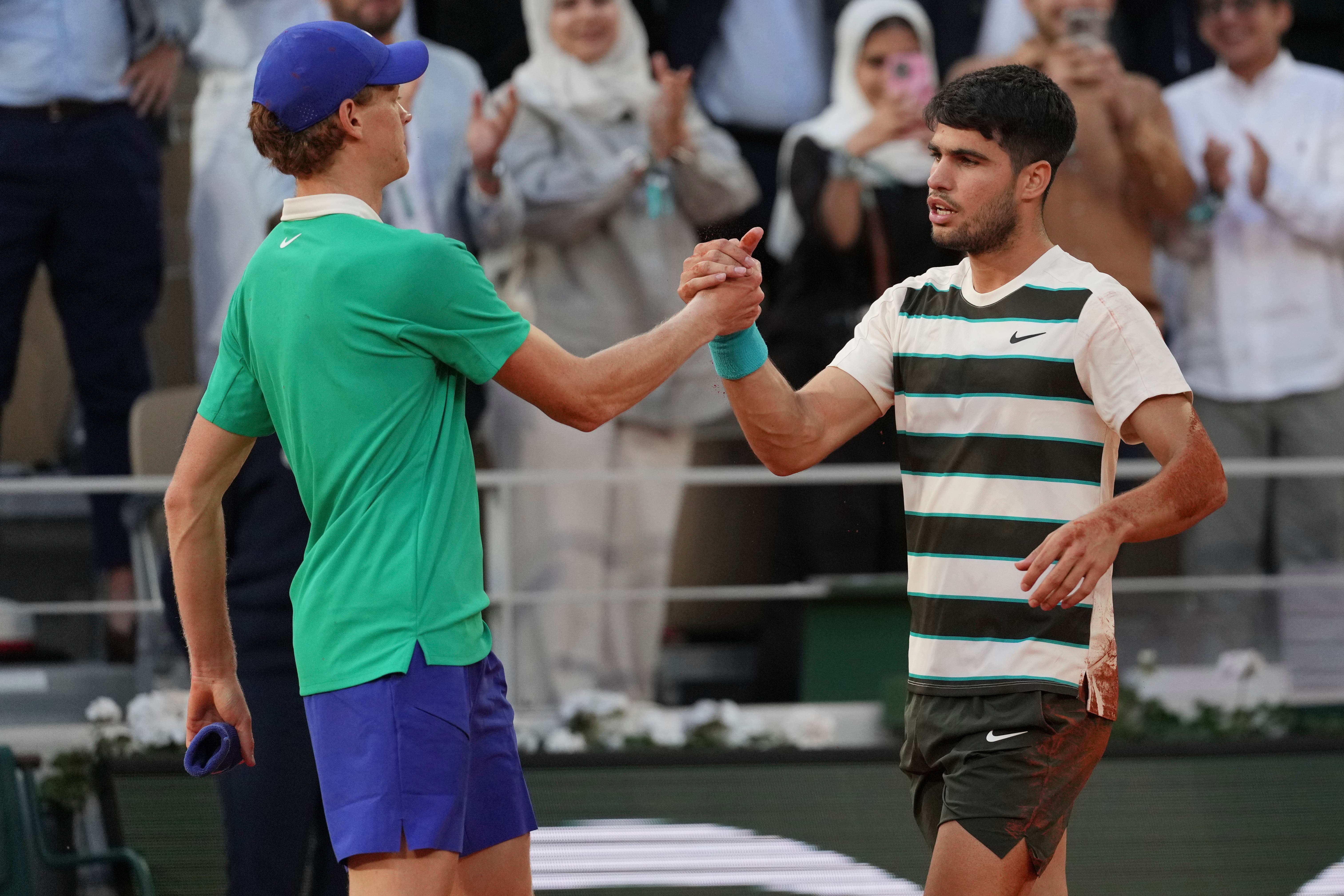 Carlos Alcaraz, right, and Jannik Sinner are the dominant forces in men’s tennis (Thibault Camus/AP)