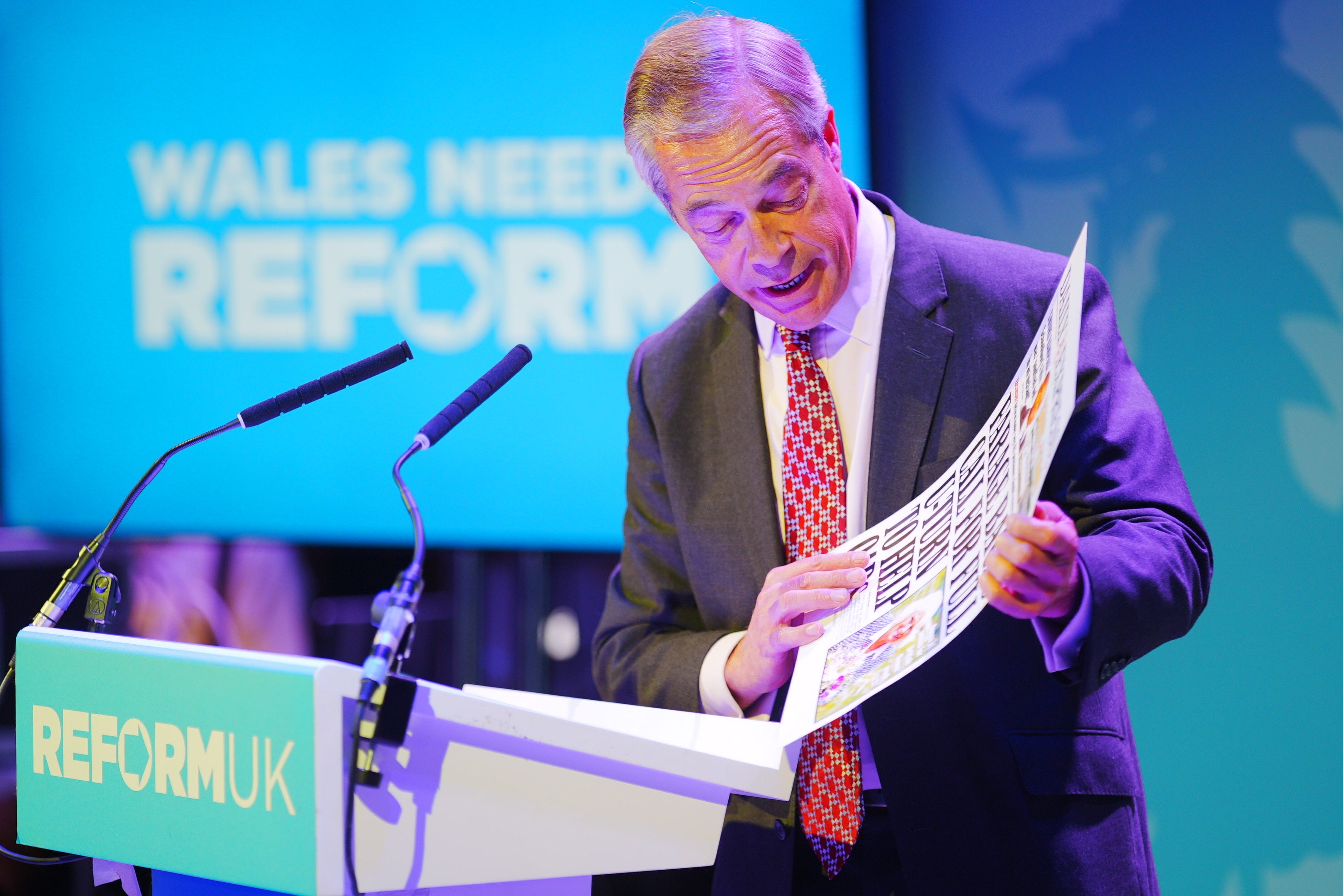 Farage reads out a front page article on his words on winter fuel