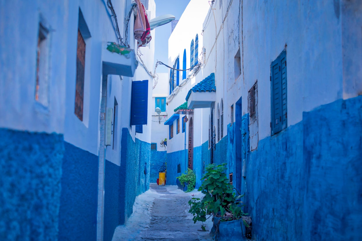 The narrow streets and the white and blue painted buildings of the Kasbah of the Udayas