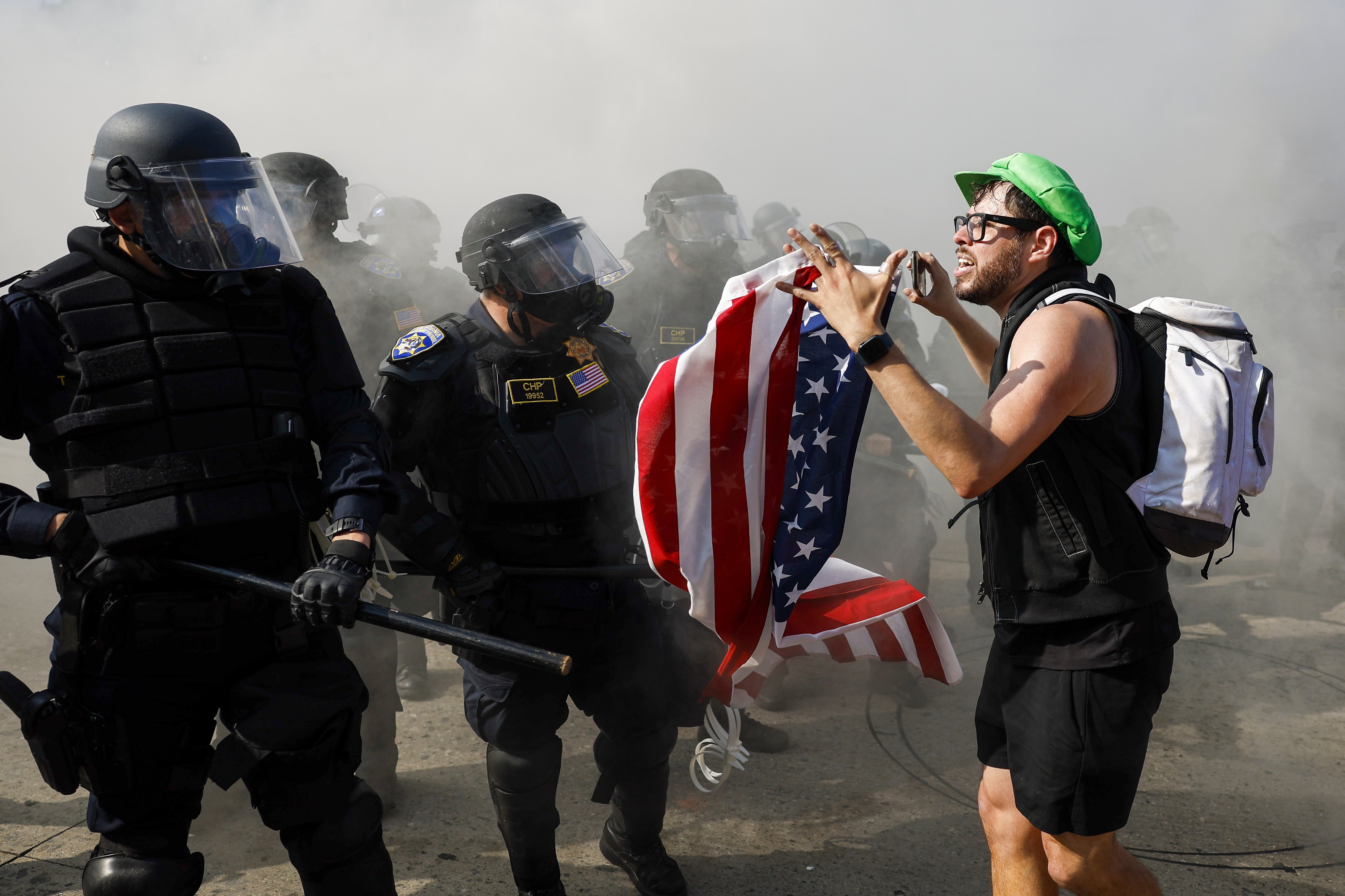 Police spent much of Sunday separating protesters from members of the National Guard