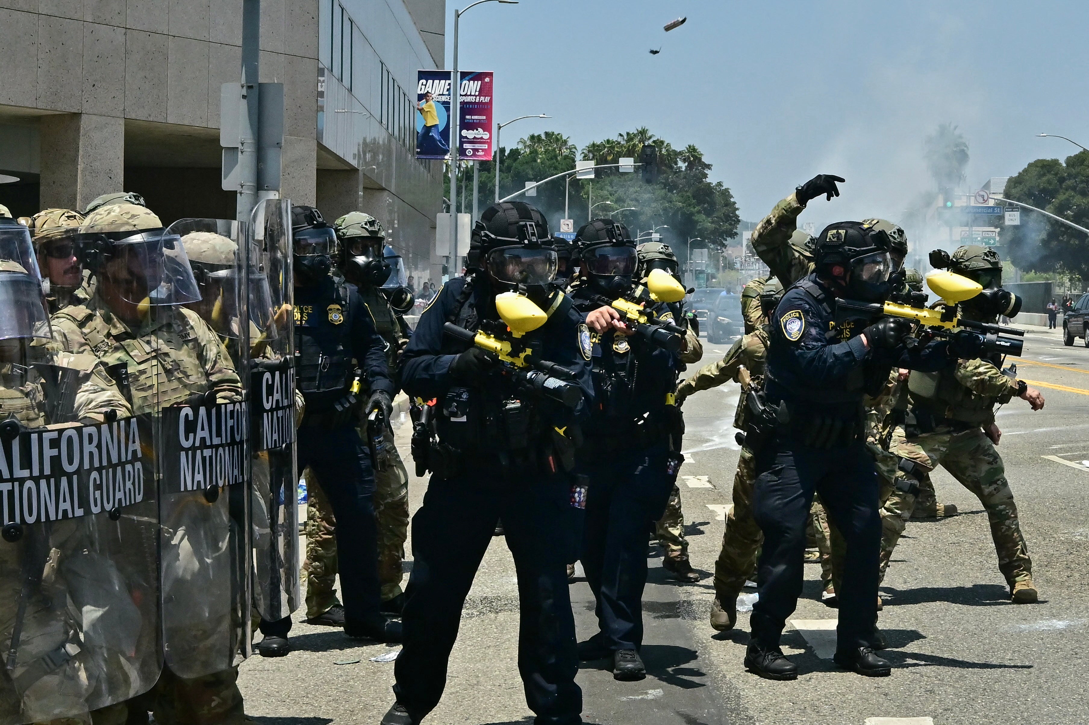 National Guard soldiers and US Department of Homeland Security officers clash with demonstrators outside the Metropolitan Detention Center in downtown Los Angeles