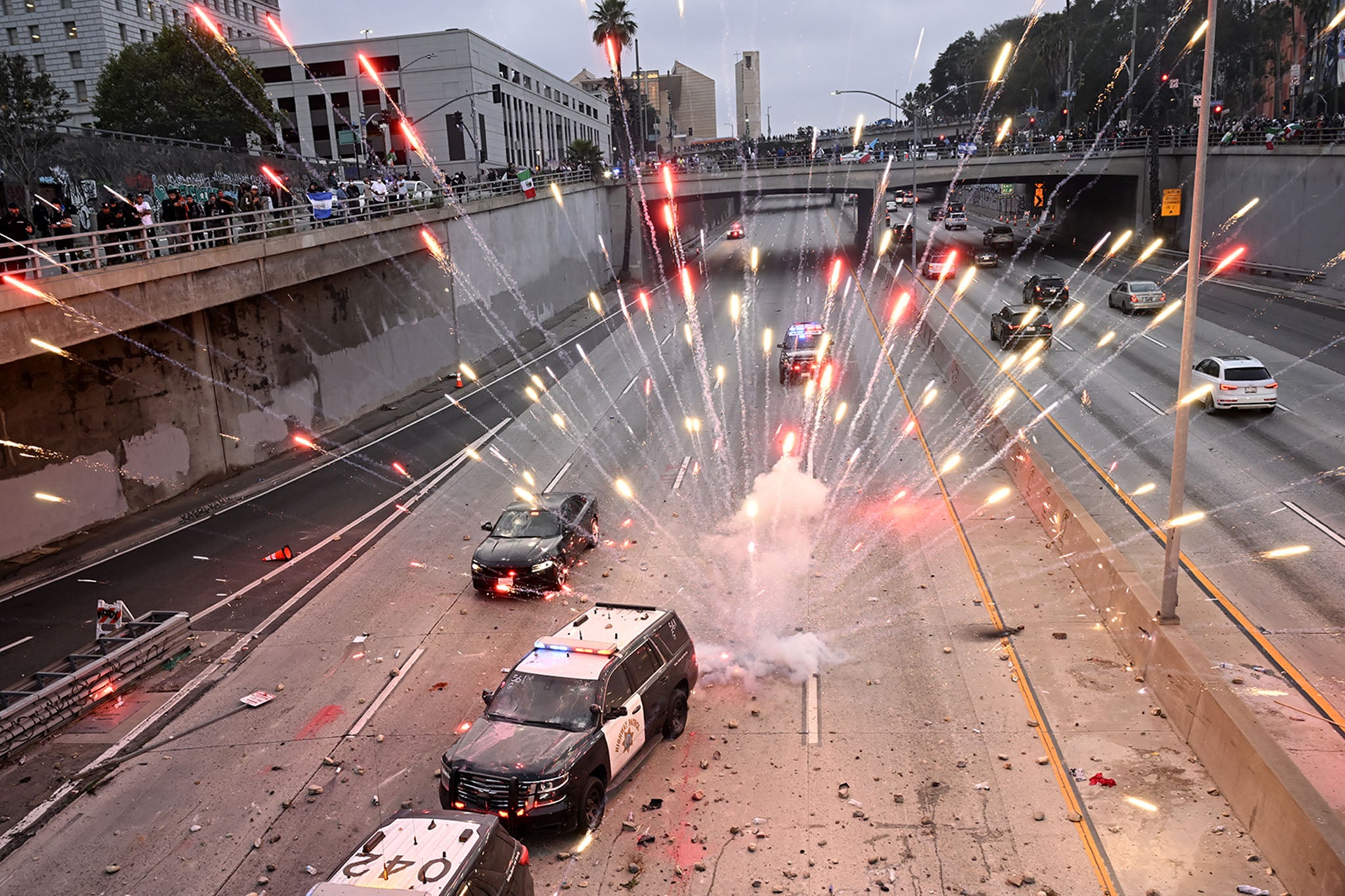 LA protests live: Trump demands ‘bring in the troops’ after dozens arrested and reports of looting
